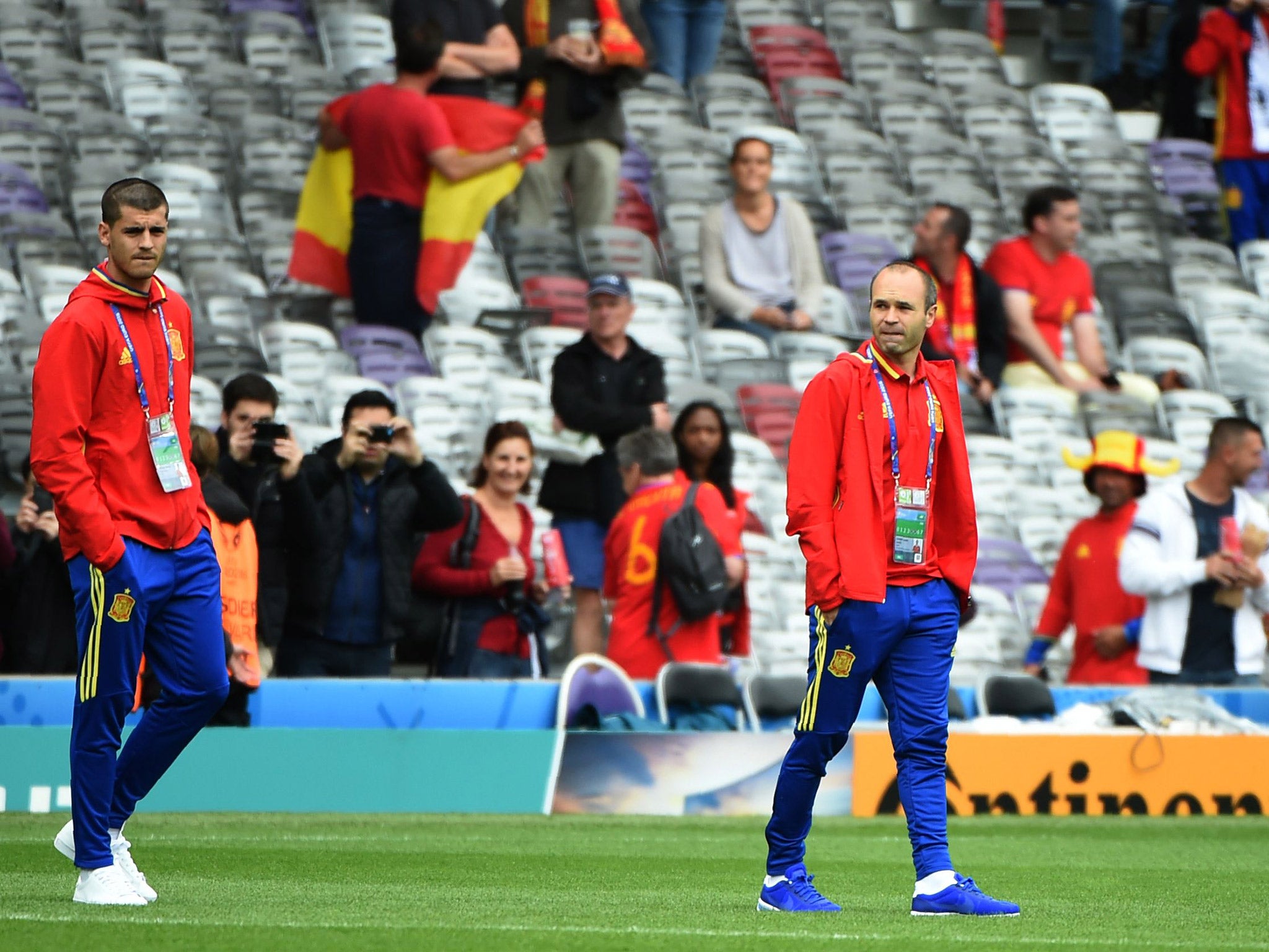 Alvaro Morata and Andres Iniesta walk out onto the Parc des Princes pitch
