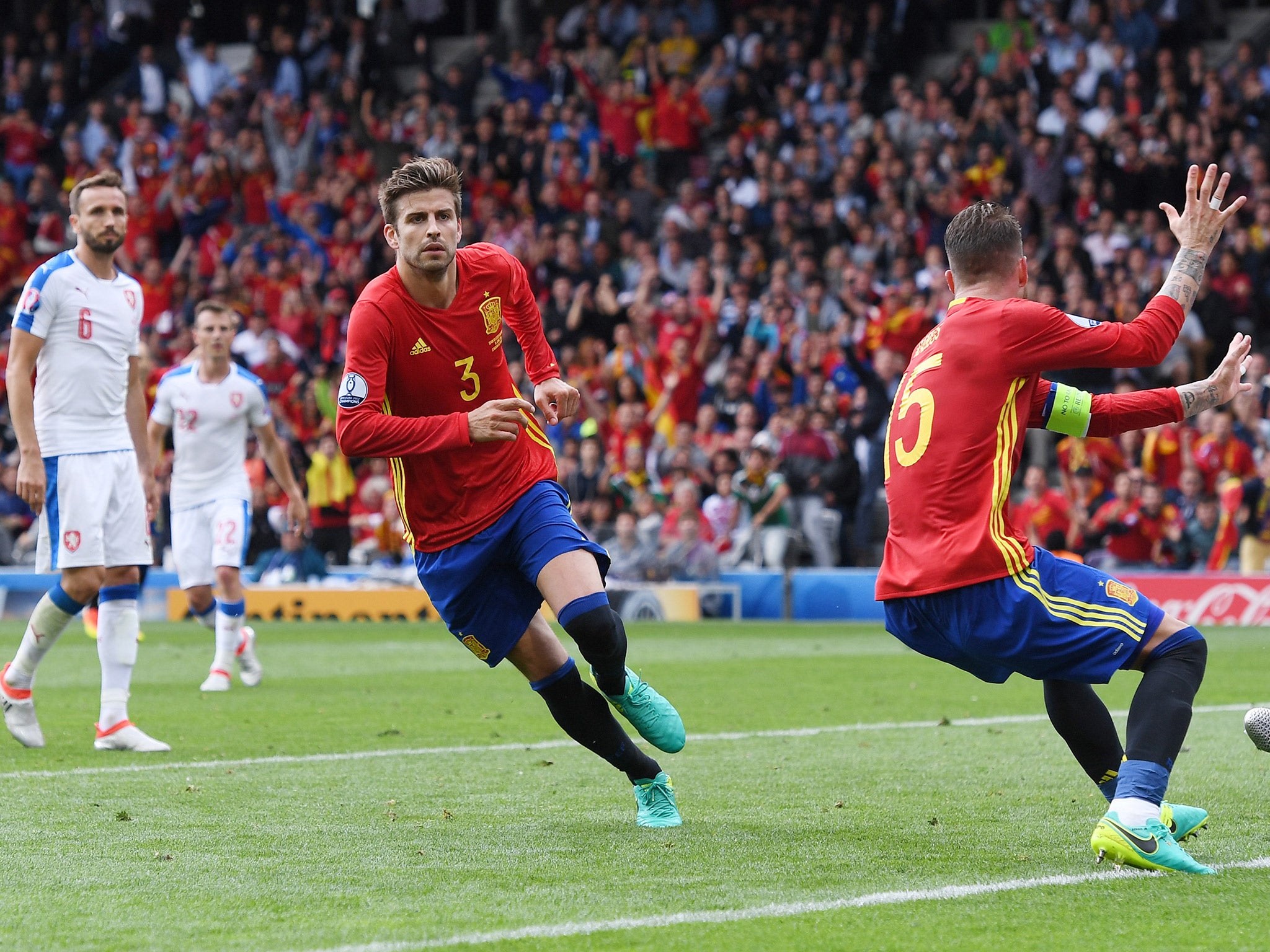 Gerard Pique turns to celebrate heading in the winning goal in Spain's 1-0 victory over Czech Republic