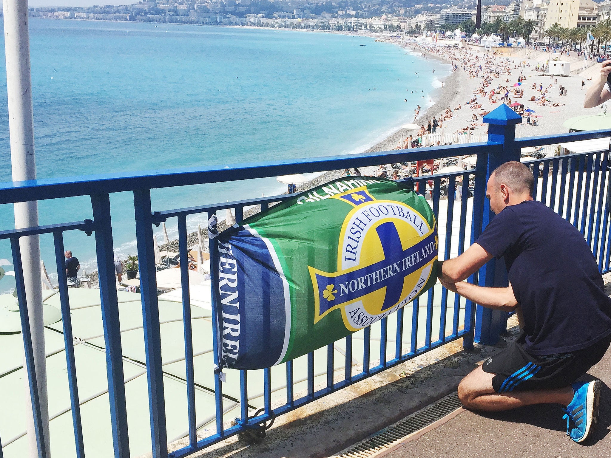 Flowers and a banner are left close to the scene where Darren Rodgers, from Ballymena, died after a fall in Nice in France.