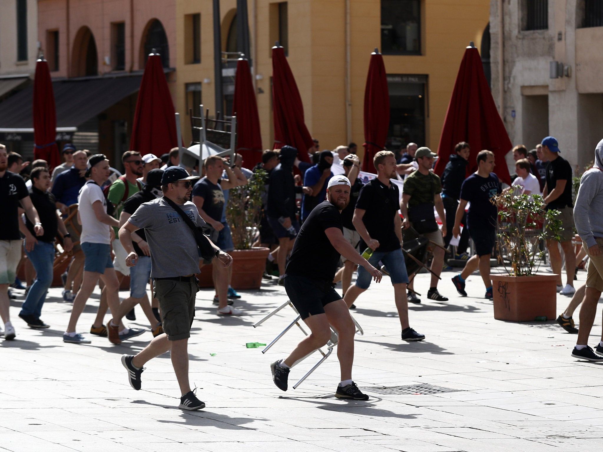 A gang of Russian fans charge towards English supporters in Marseille