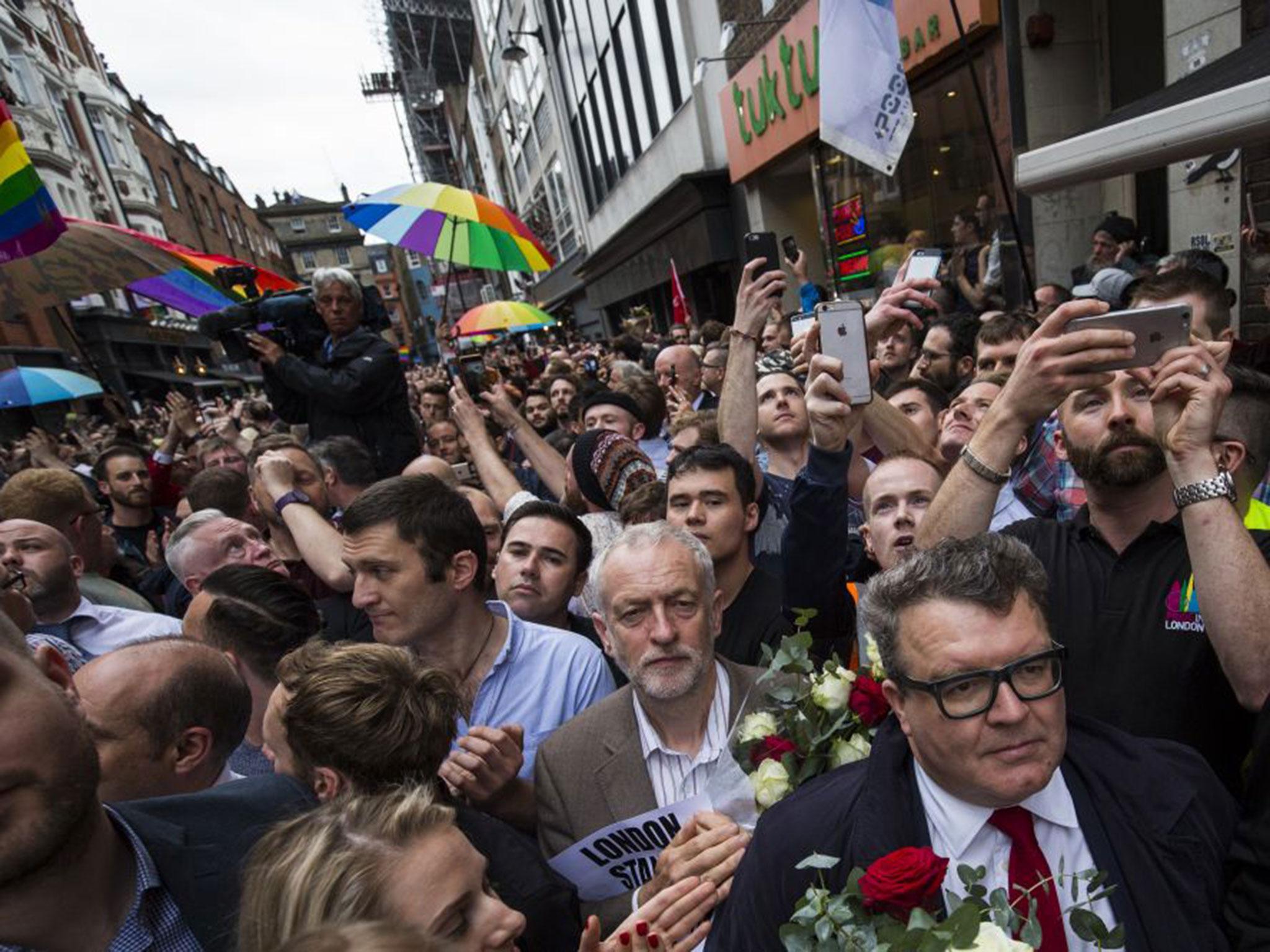 Thousands, including Labour party leader Jeremy Corbyn, lined the streets of Soho for two minutes silence