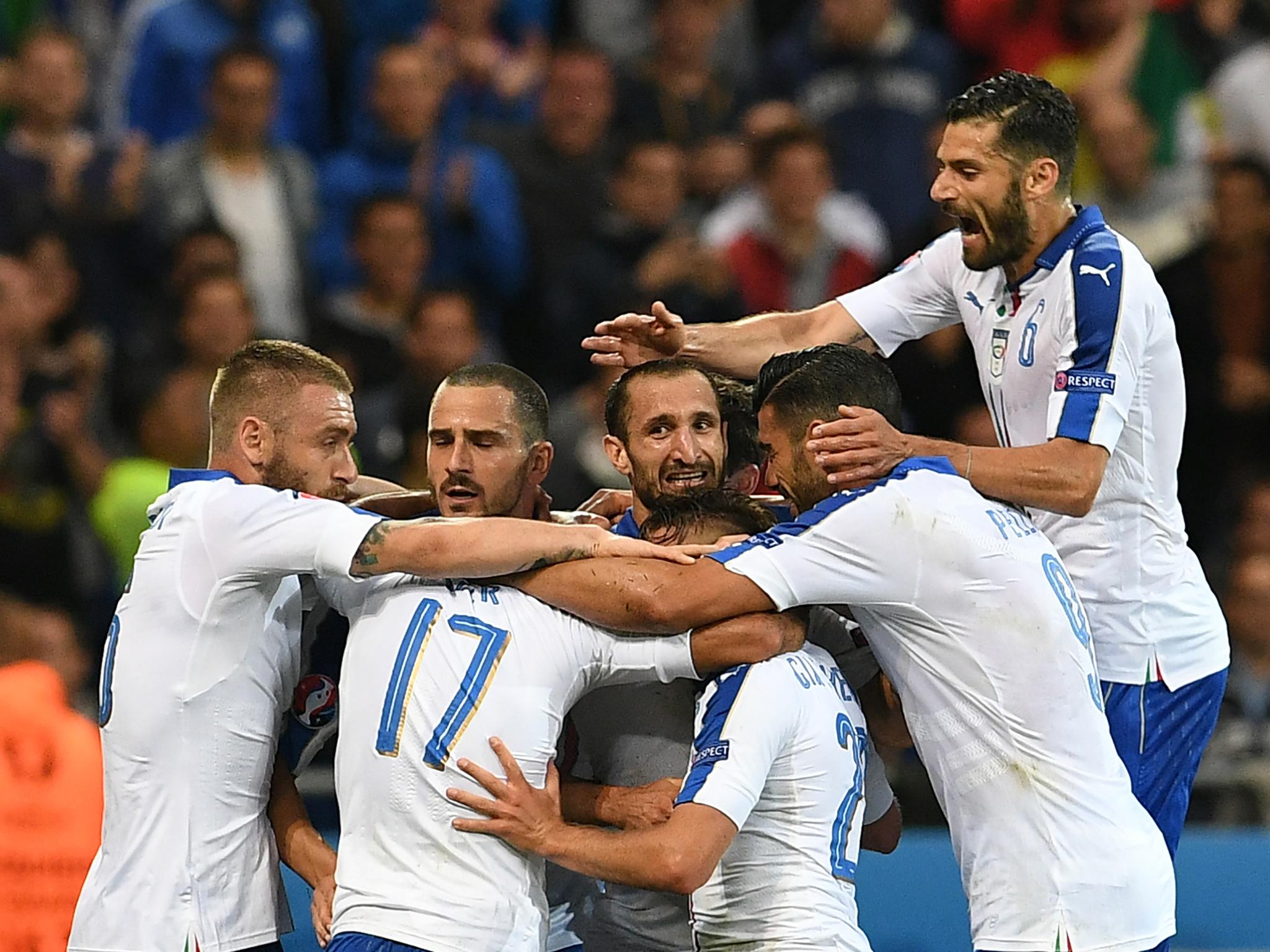 Italy's players mob Giaccherini after his opening goal