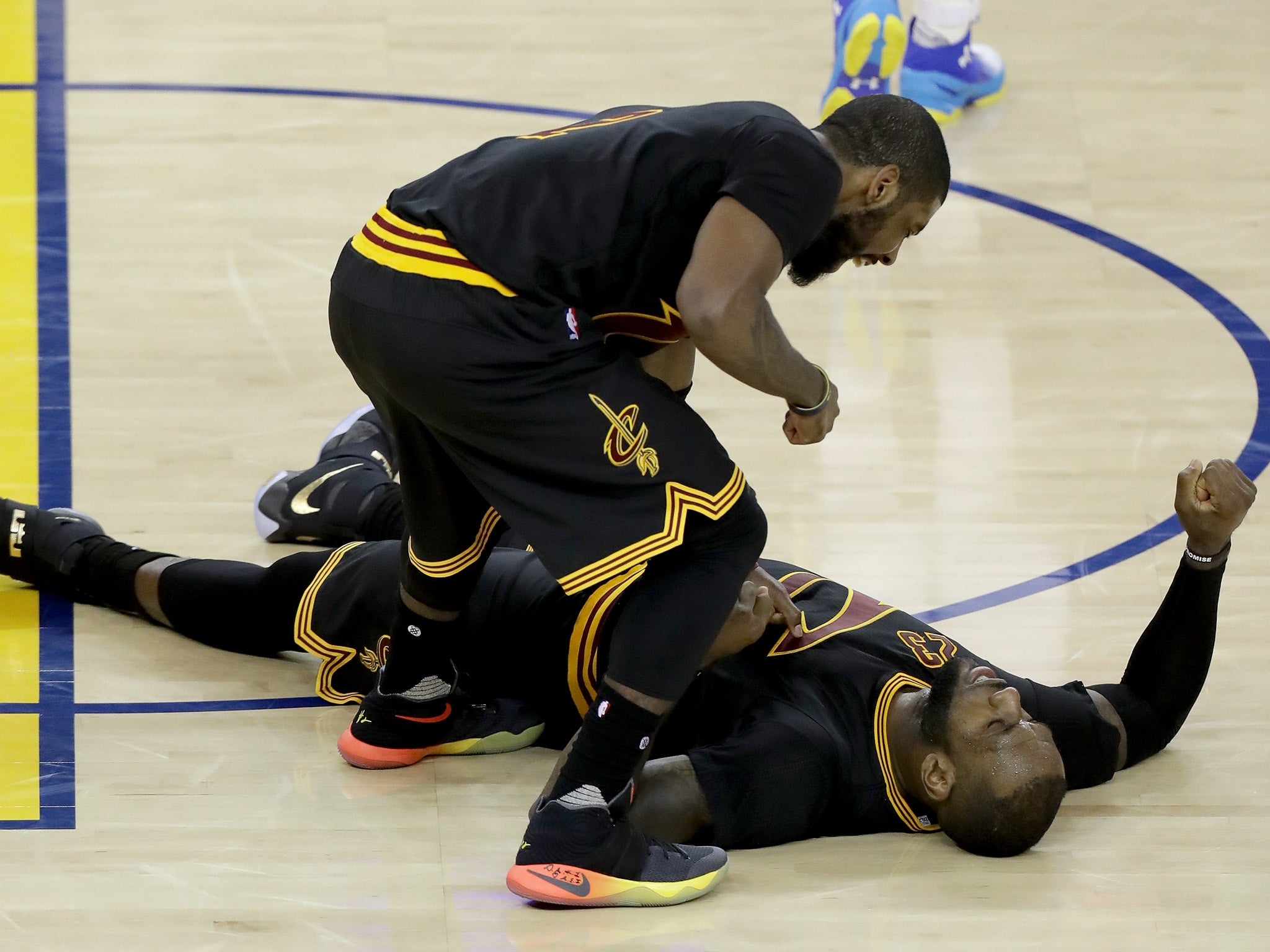 LeBron James and Kyrie Irving celebrate after Cleveland Cavaliers beat Golden State Warriors