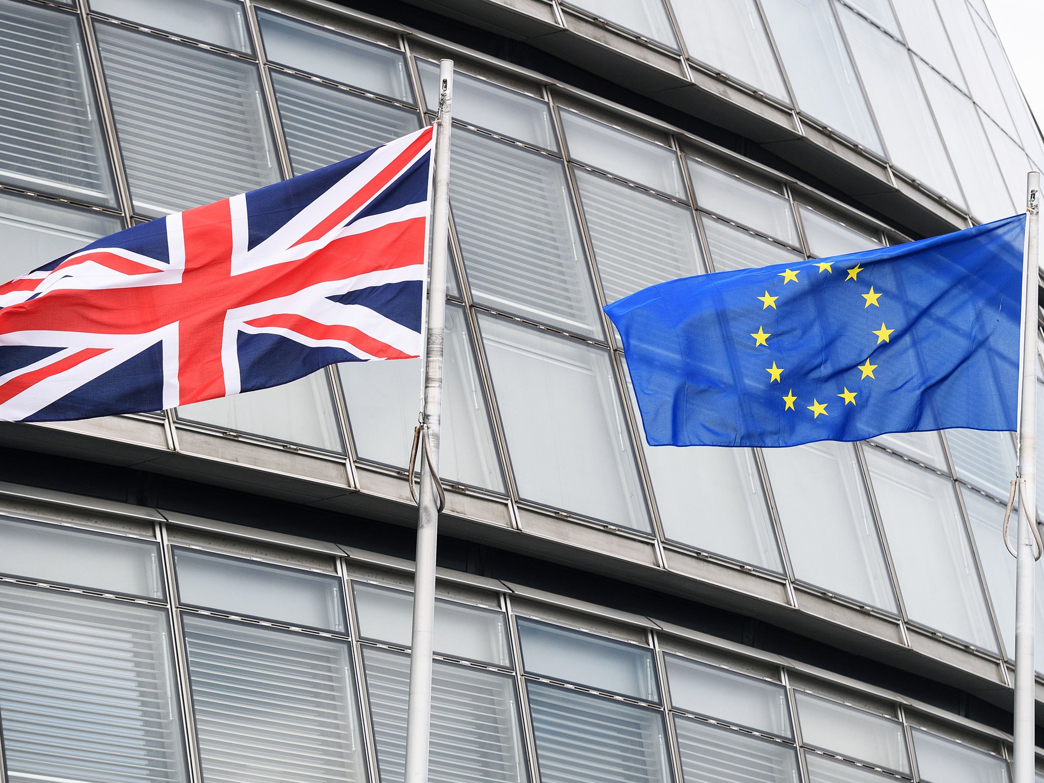 The British union flag and the European union flag outside City Hall, central London