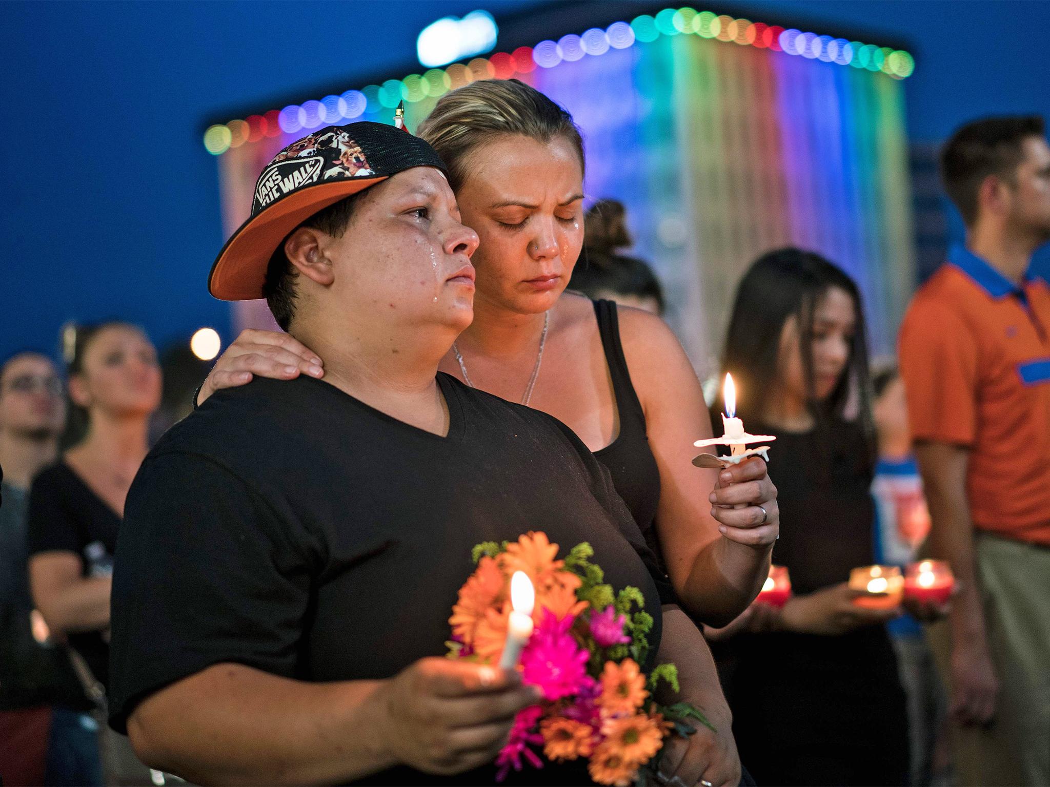 Nicole Edwards and her wife Kellie Edwards observe a moment of silence after the mass shooting at the Pulse nightclub in June in Orlando, Florida