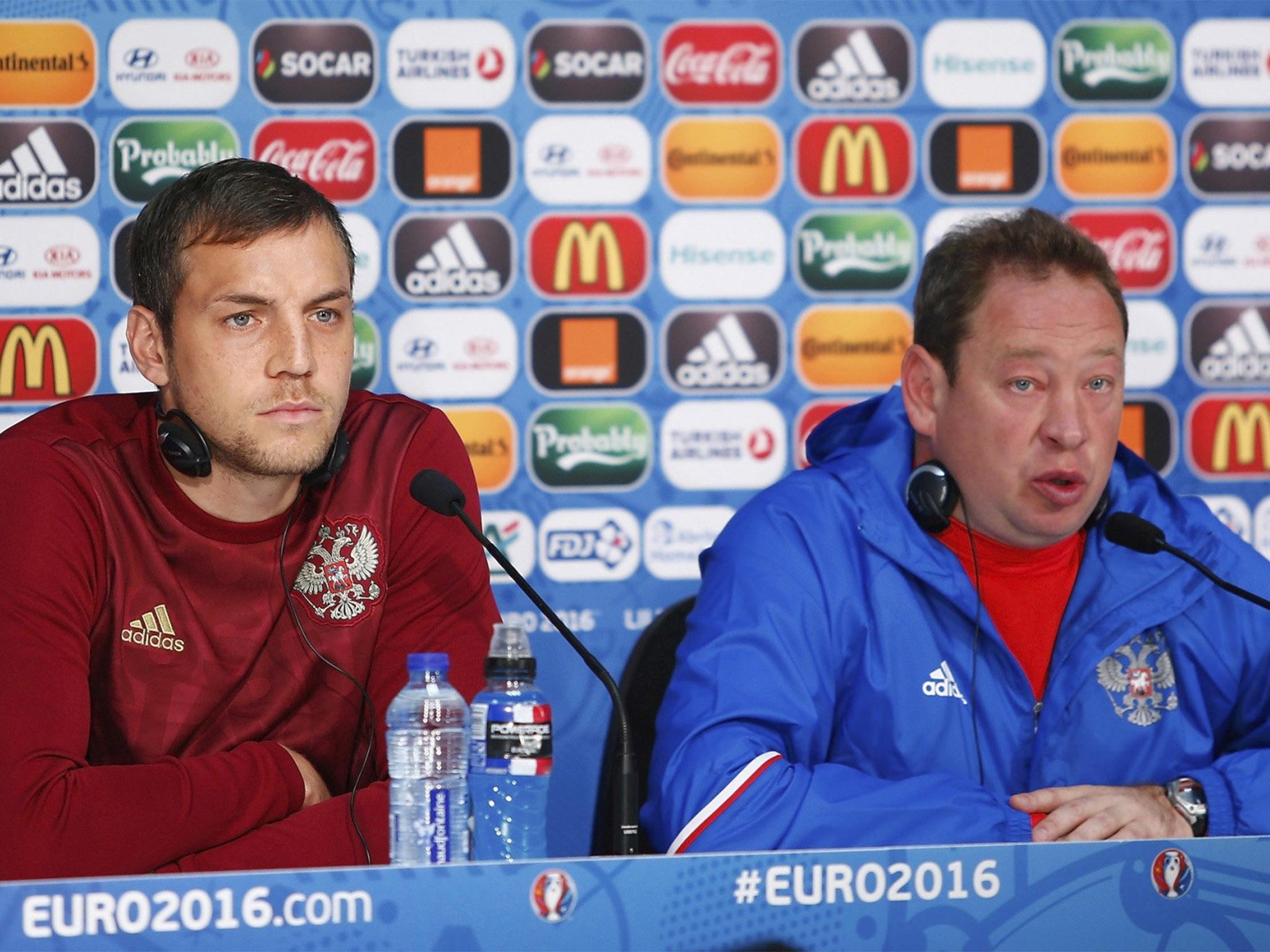 Russian striker Artem Dzyuba alongside head coach Leonid Slutski, in Lille