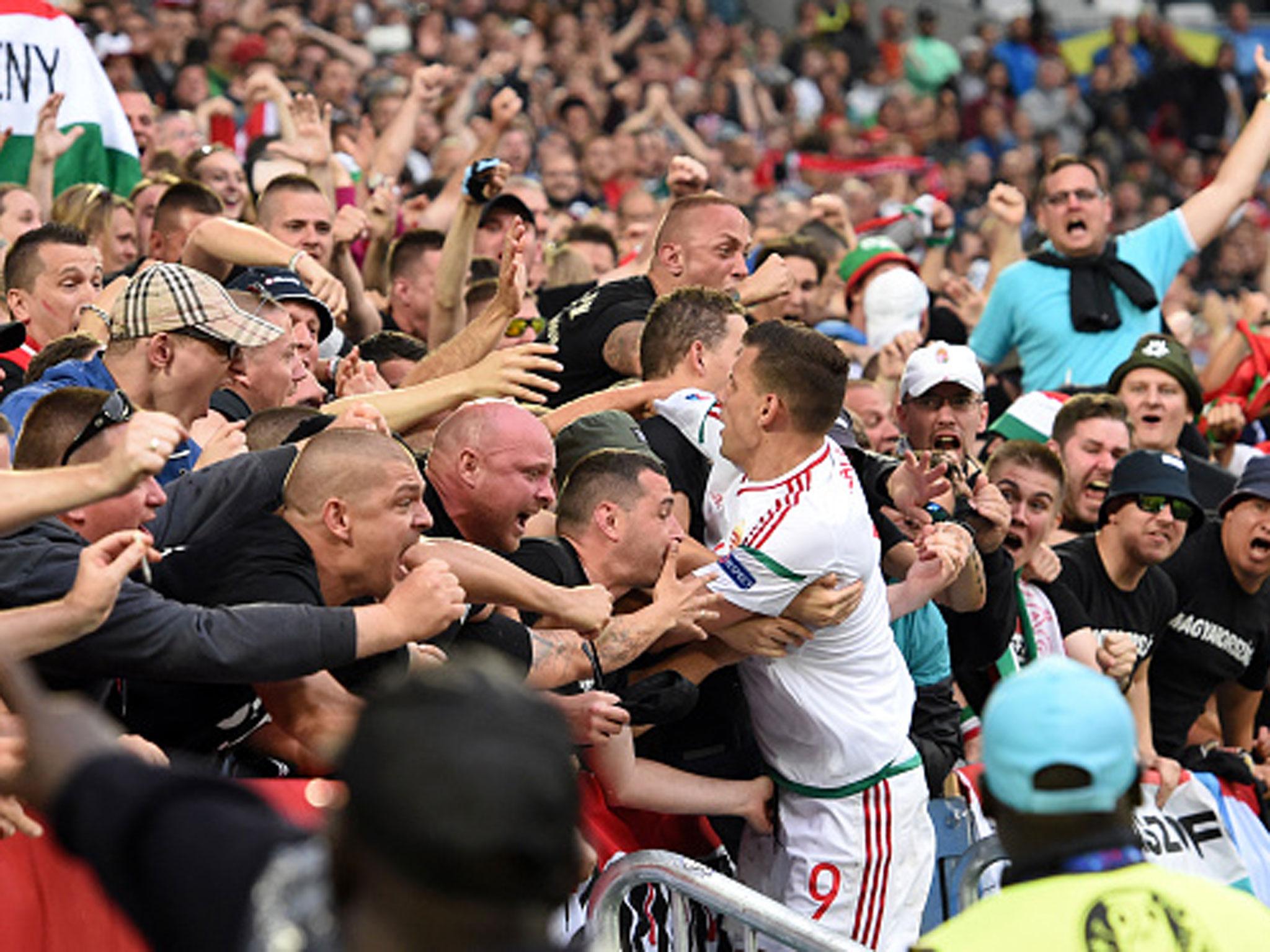 &#13;
Adam Szalai is congratulated by the Hungary fans after opening the scoring on Tuesday (Getty)&#13;