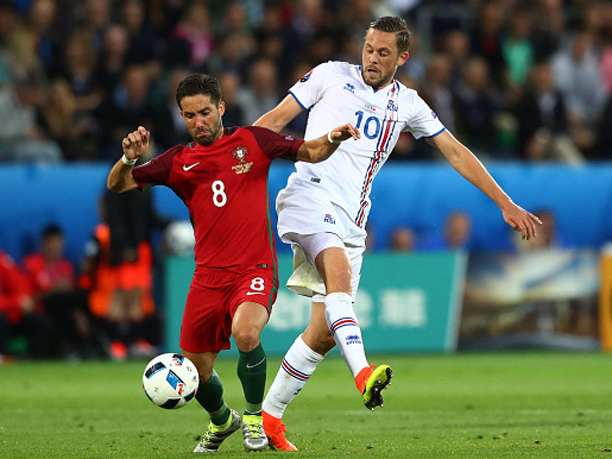 &#13;
Joao Moutinho holds off Gylfi Sigurdsson in Saint-Etienne on Tuesday evening (Getty)&#13;