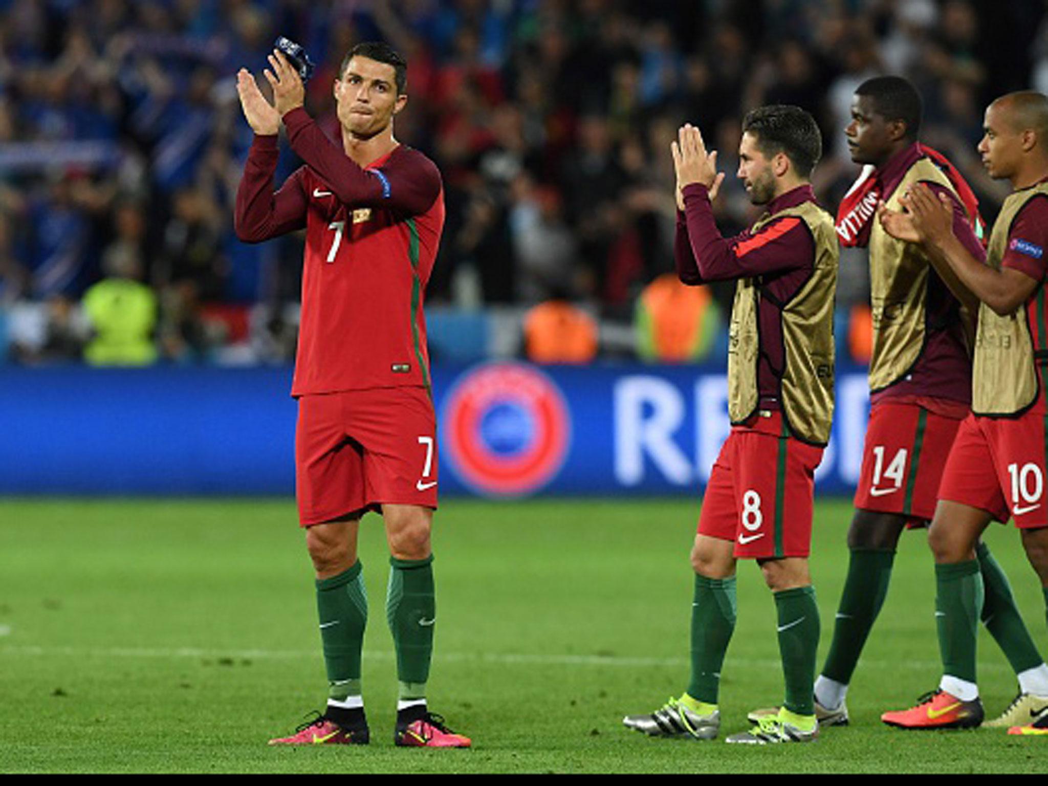 A dejected Cristiano Ronaldo applauds the fans at the final whistle in Saint-Etienne (Getty)