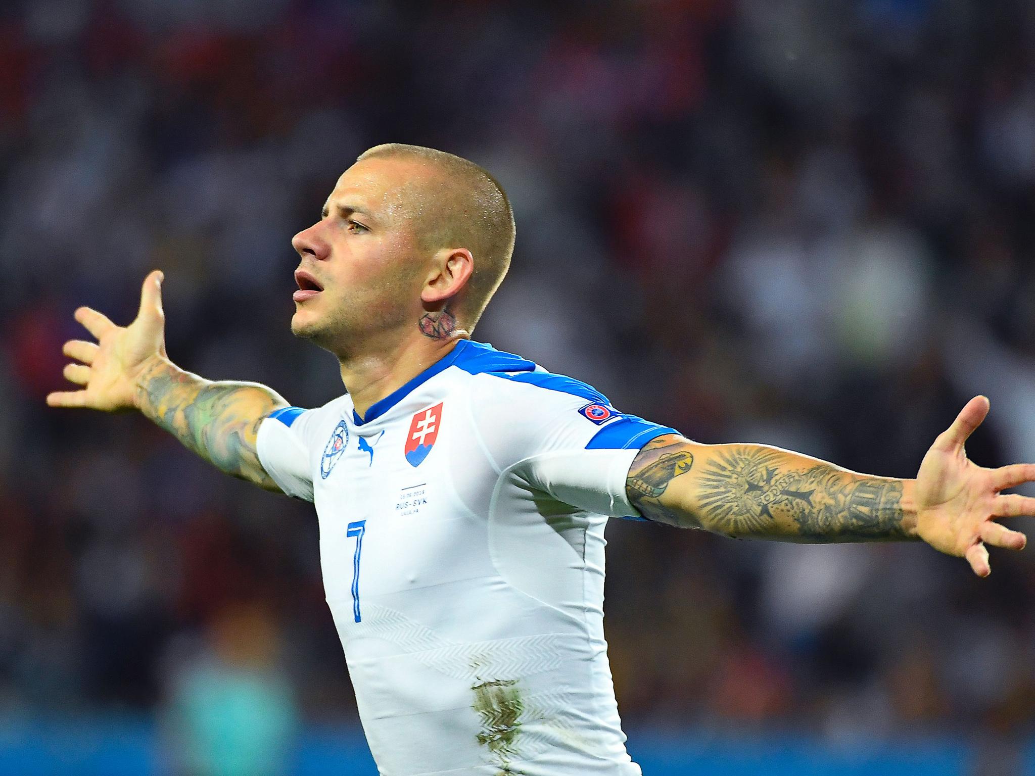 Weiss celebrates opening the scoring in Lille