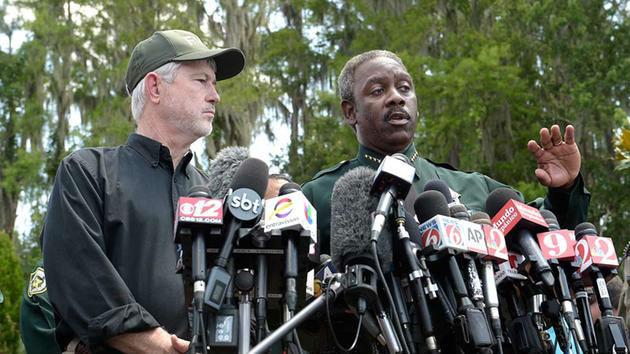 Sheriff Jerry Demings (right) said he had broken the news to the parents in the presence of a Catholic priest