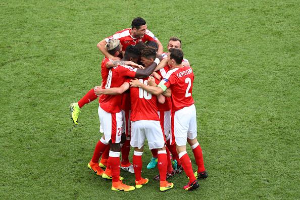 Switzerland players celebrate Mehmedi's fine second-half equaliser (Getty)