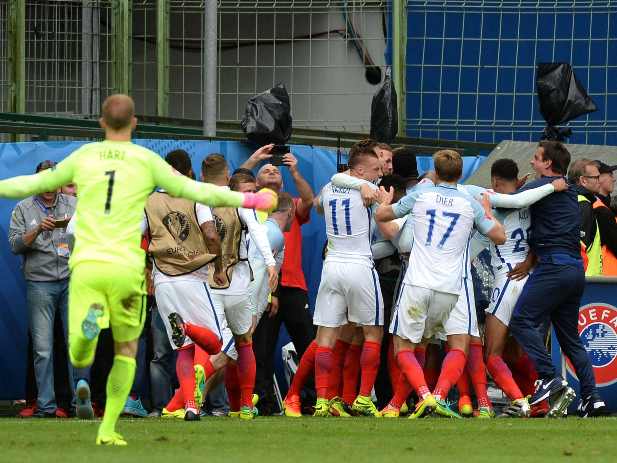 Gary Neville and Joe Hart sprinted to join in as England celebrated the winning goal over Wales
