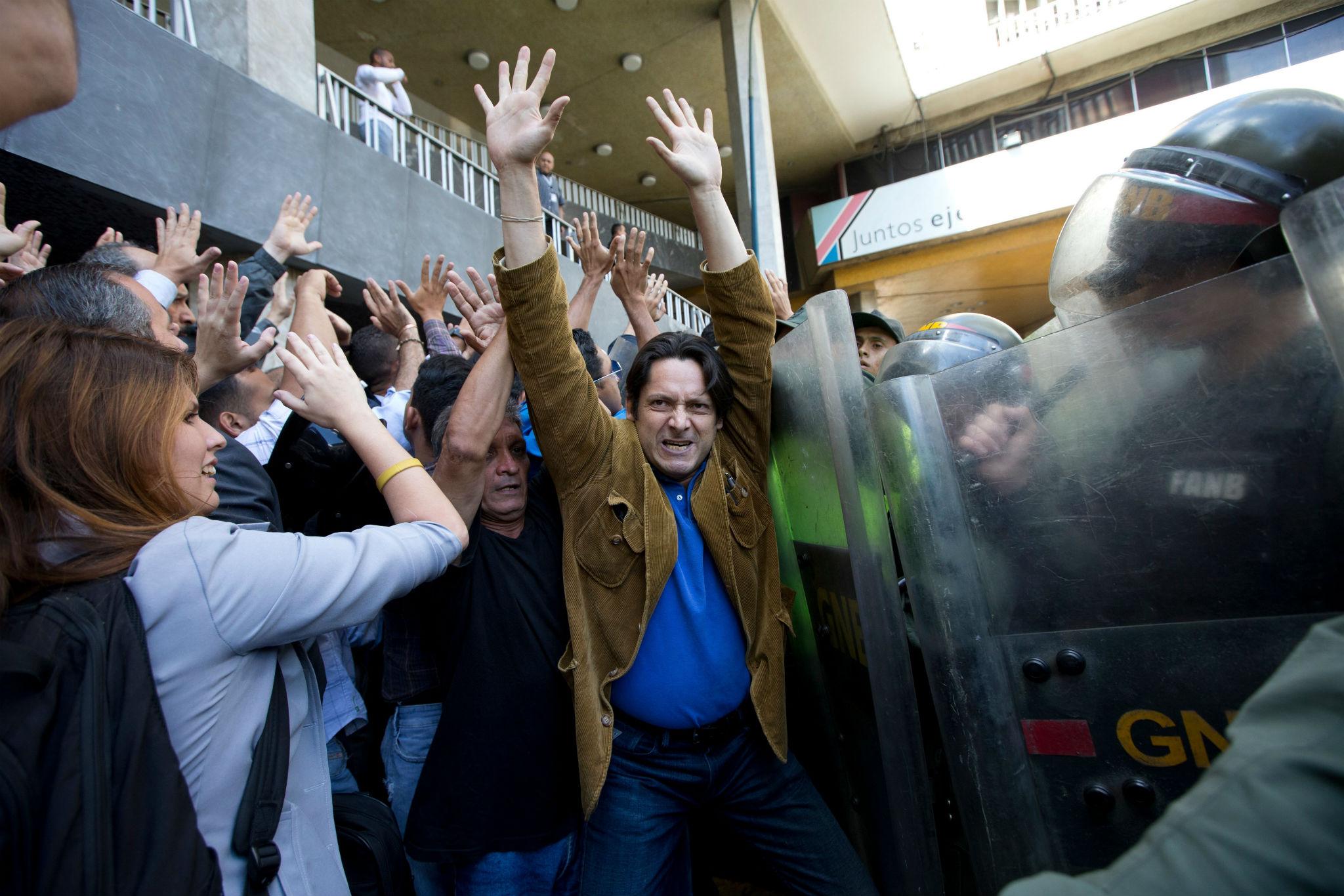 Police and protesters clash in Caracas, where opposition activists are demanding a recall referendum against President Nicolas Maduro