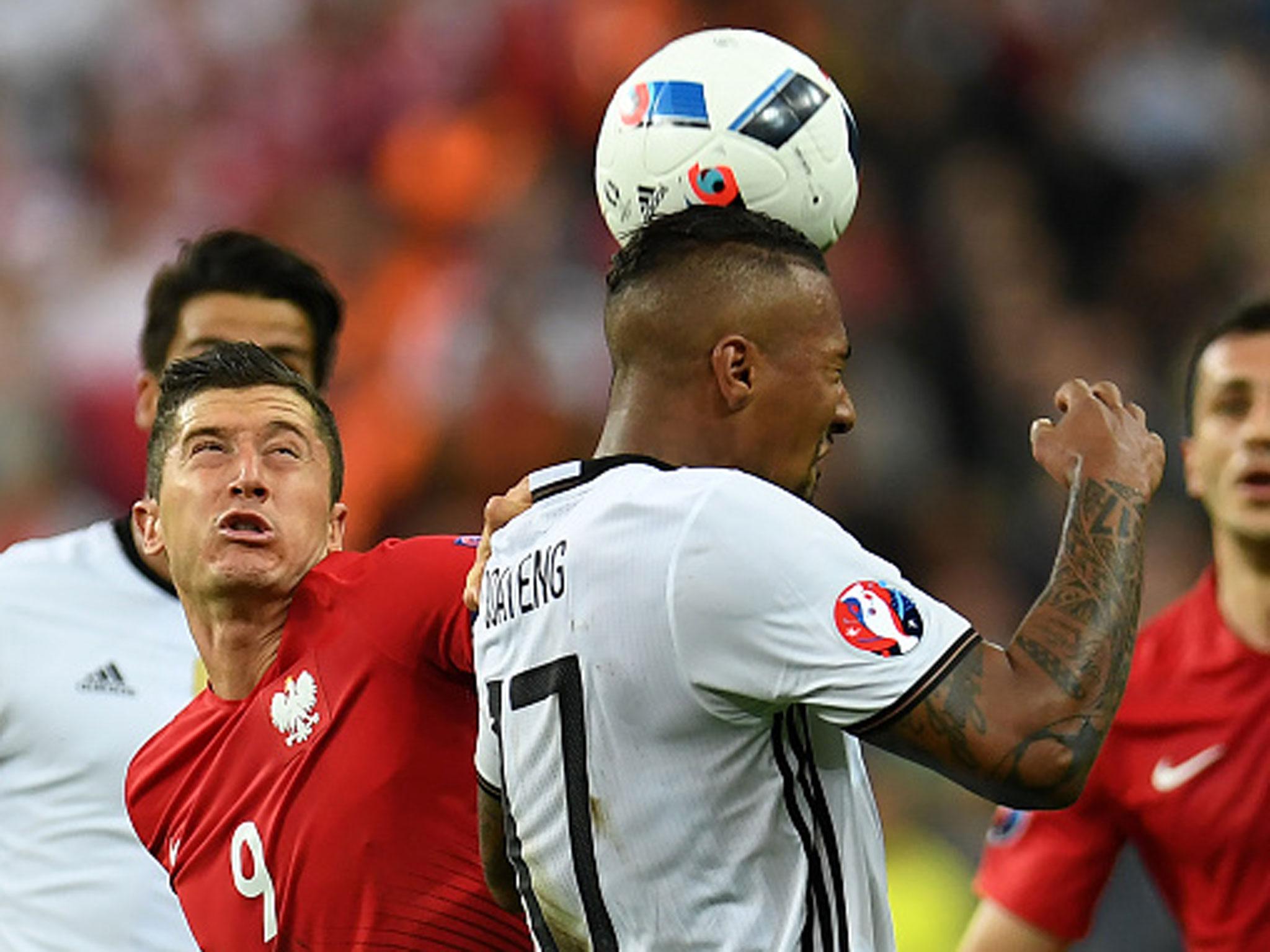 Robert Lewandowski and Jerome Boateng challenge for a header during Thursday's draw in Paris (Getty)