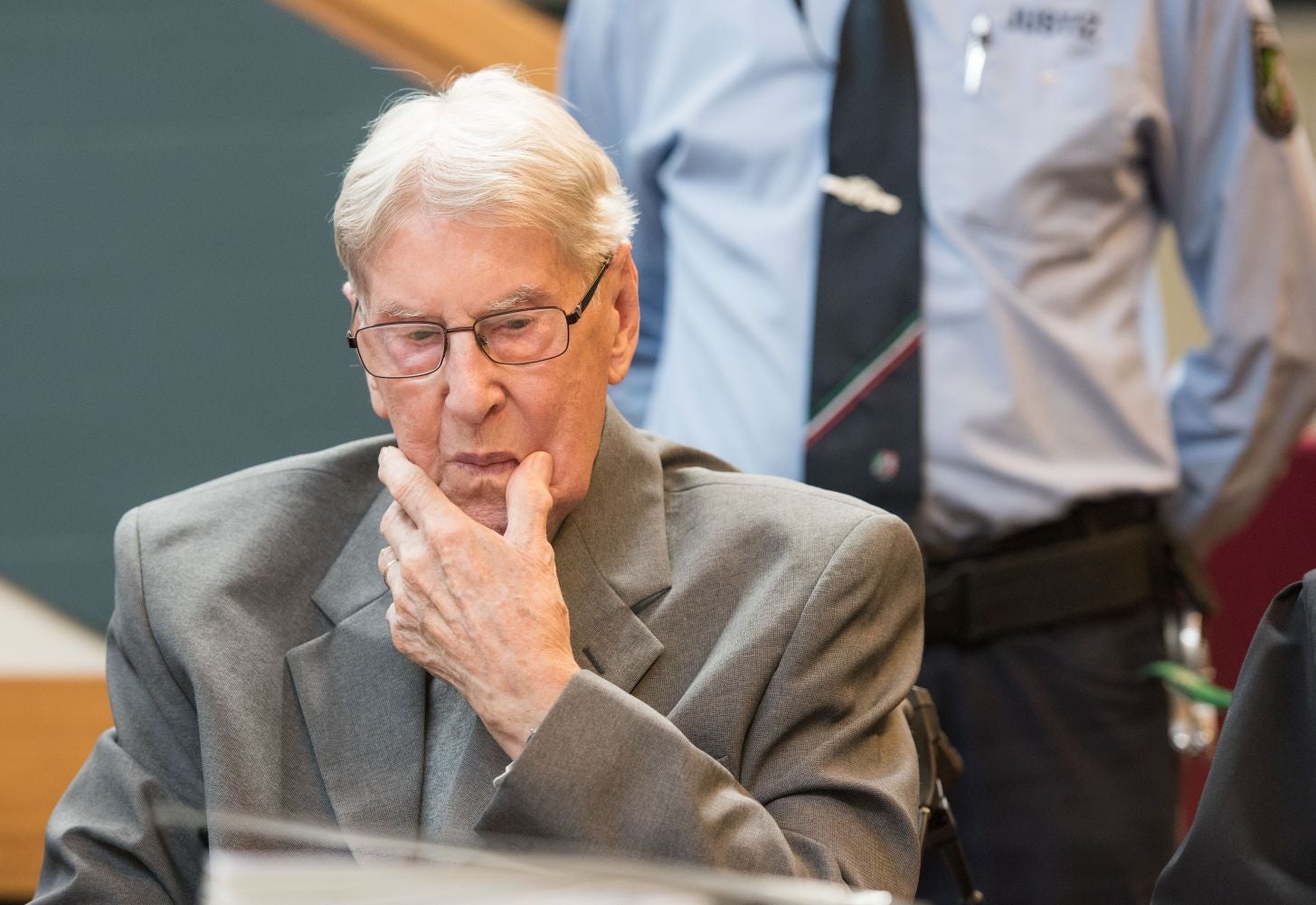 94-year-old former SS sergeant Reinhold Hanning sits in the courtroom in Detmold