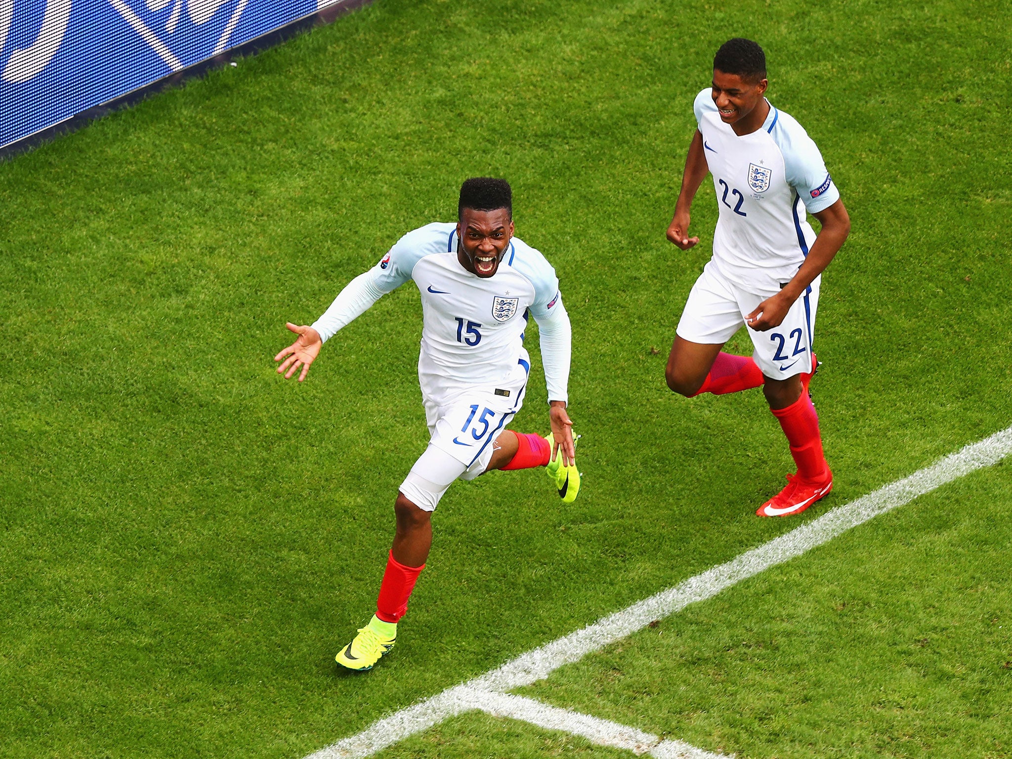 Marcus Rashford rushes to congratulate goalscorer Daniel Sturridge after England's late winner against Wales