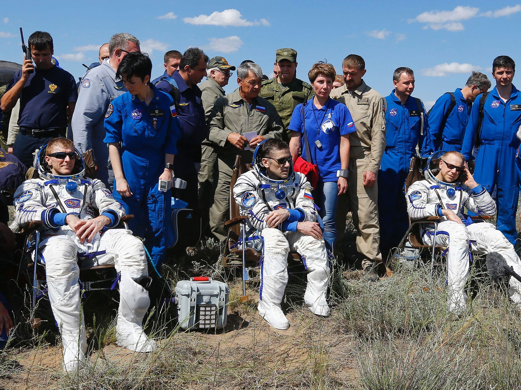 Astronauts Tim Peake of Britain, Yuri Malenchenko of Russia and Tim Kopra of the US after landing in Kazakhstan