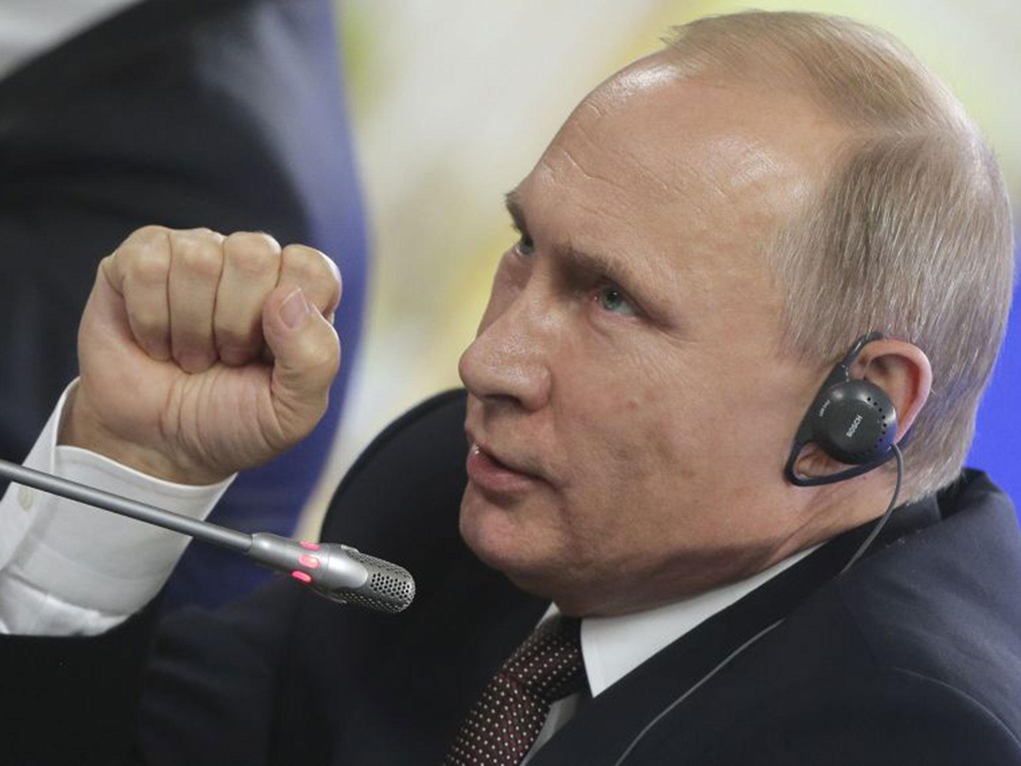 Russian President Vladimir Putin addressing the media