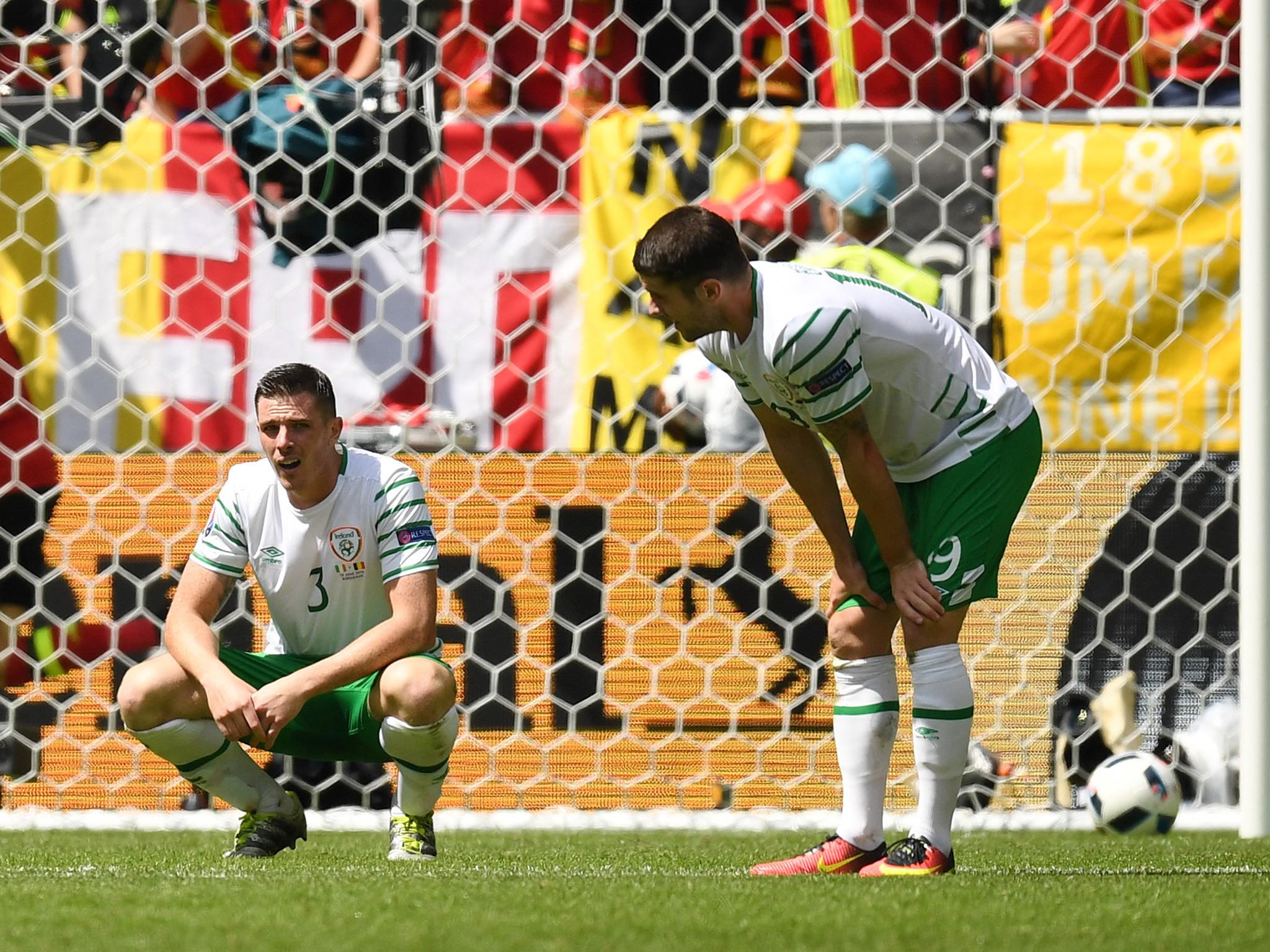 Clark and Brady look on after Belgium's third goal