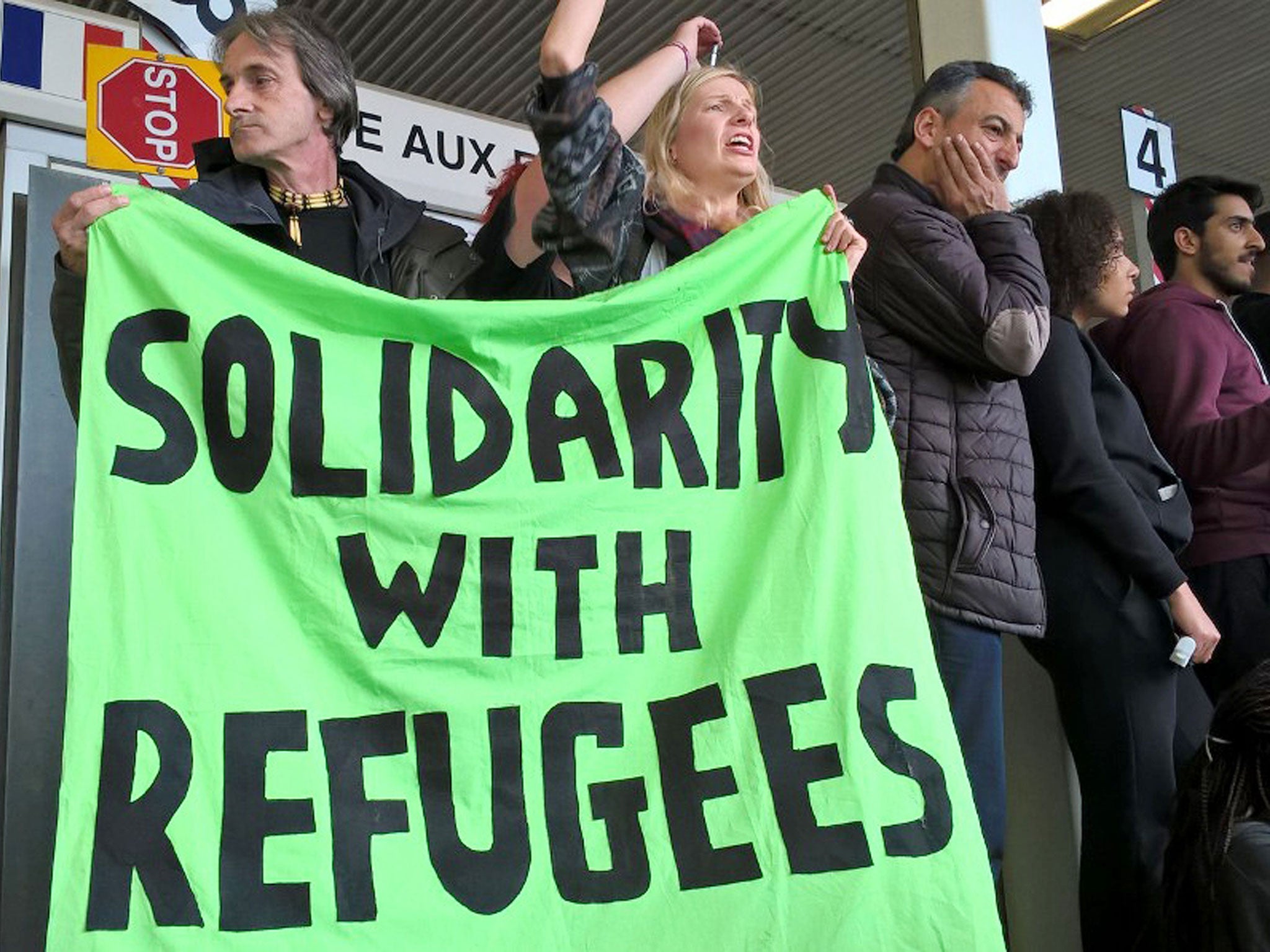 Volunteers holding an impromptu rally in Dover, Kent, after an aid convoy was refused entry to France by authorities.