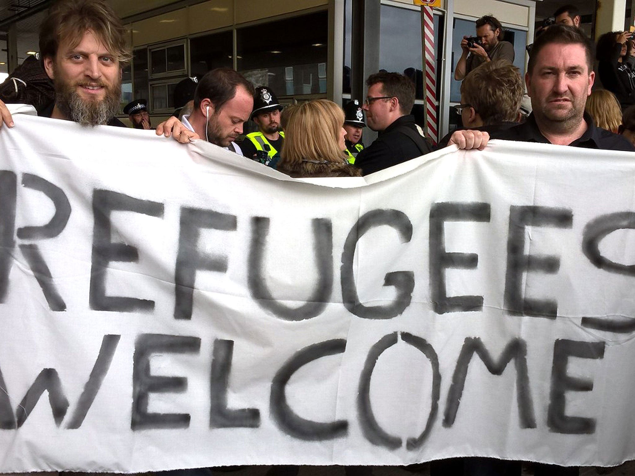 Volunteers holding an impromptu rally in Dover, Kent, after an aid convoy was refused entry to France by authorities.