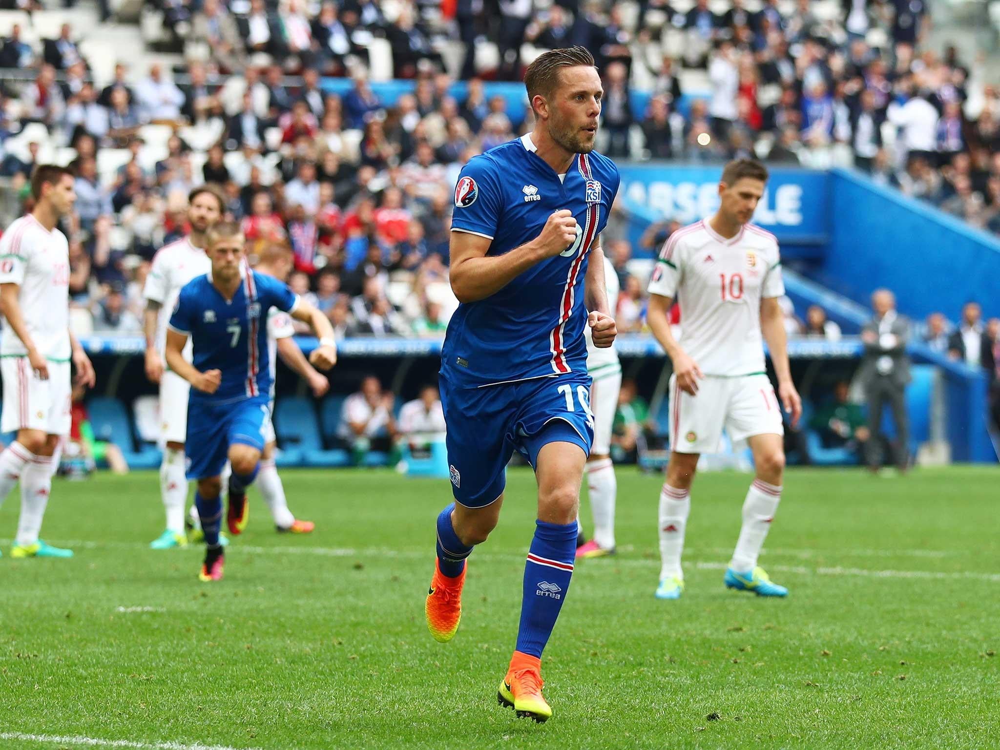 Gylfi Sigurdsson wheels away after opening the scoring