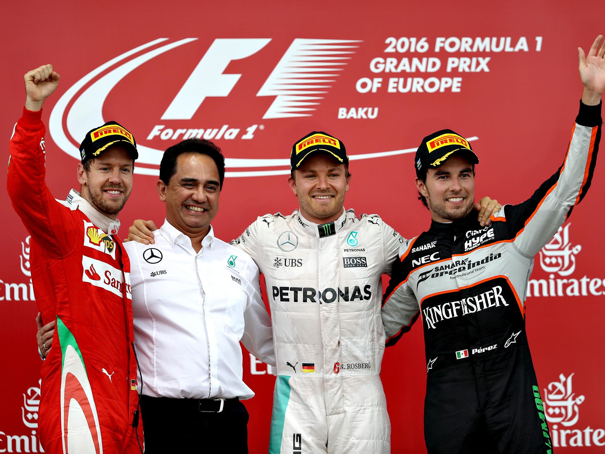 Rosberg poses on the podium with Vettell and Perez