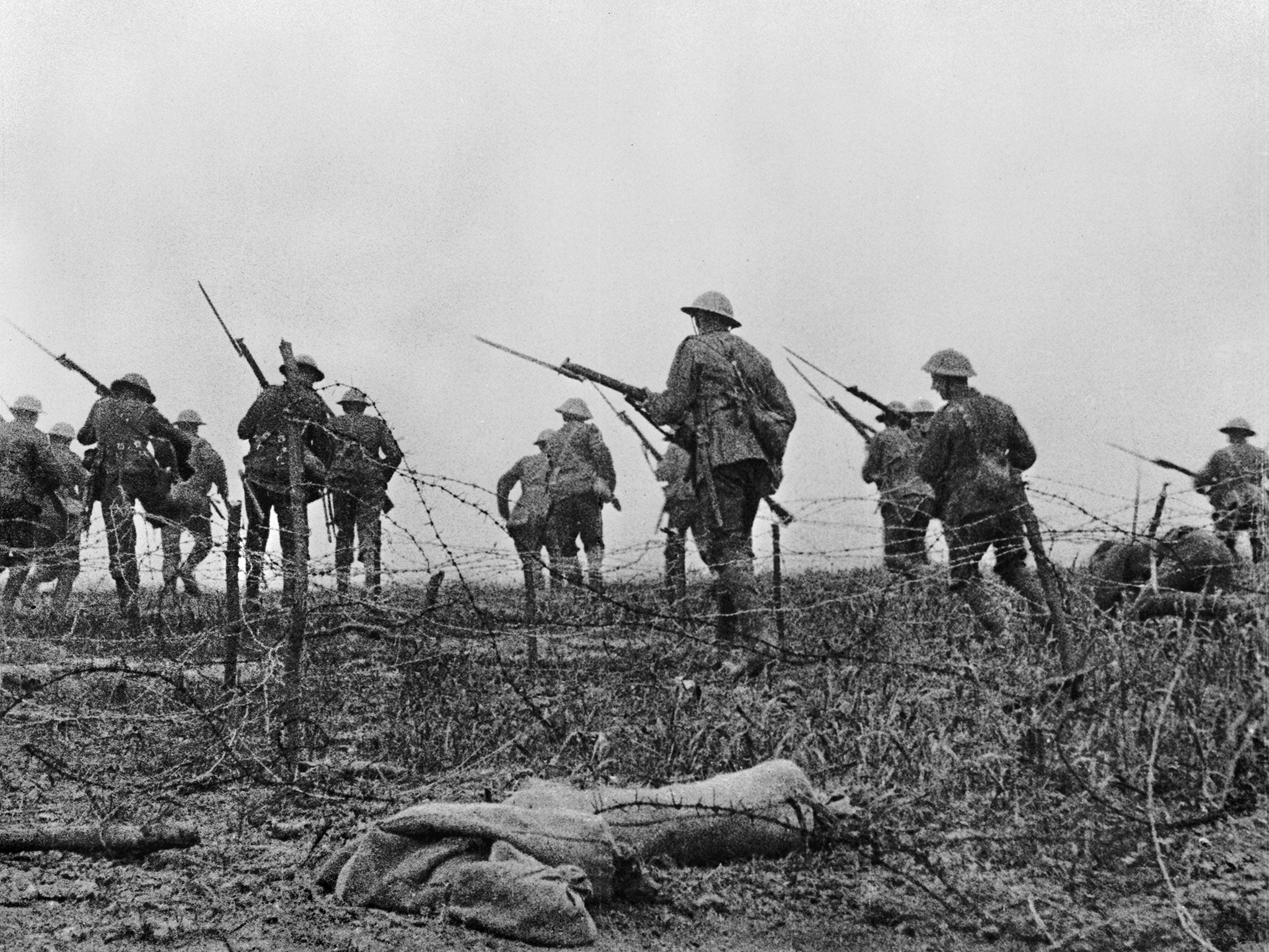 Soldiers marching across No-man's land with fixed bayonets