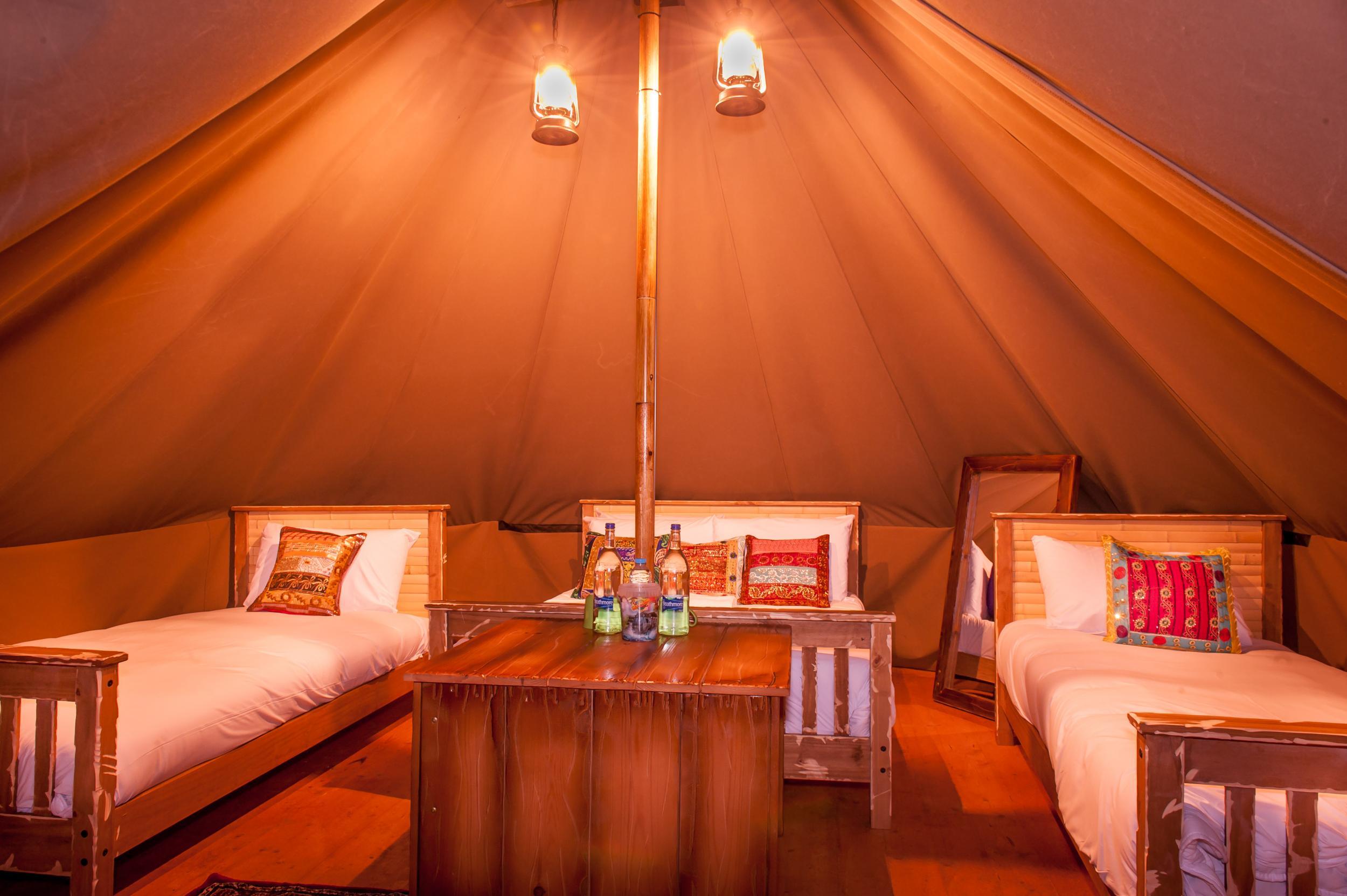 There are 31 circular standard tents with a double bed and two singles