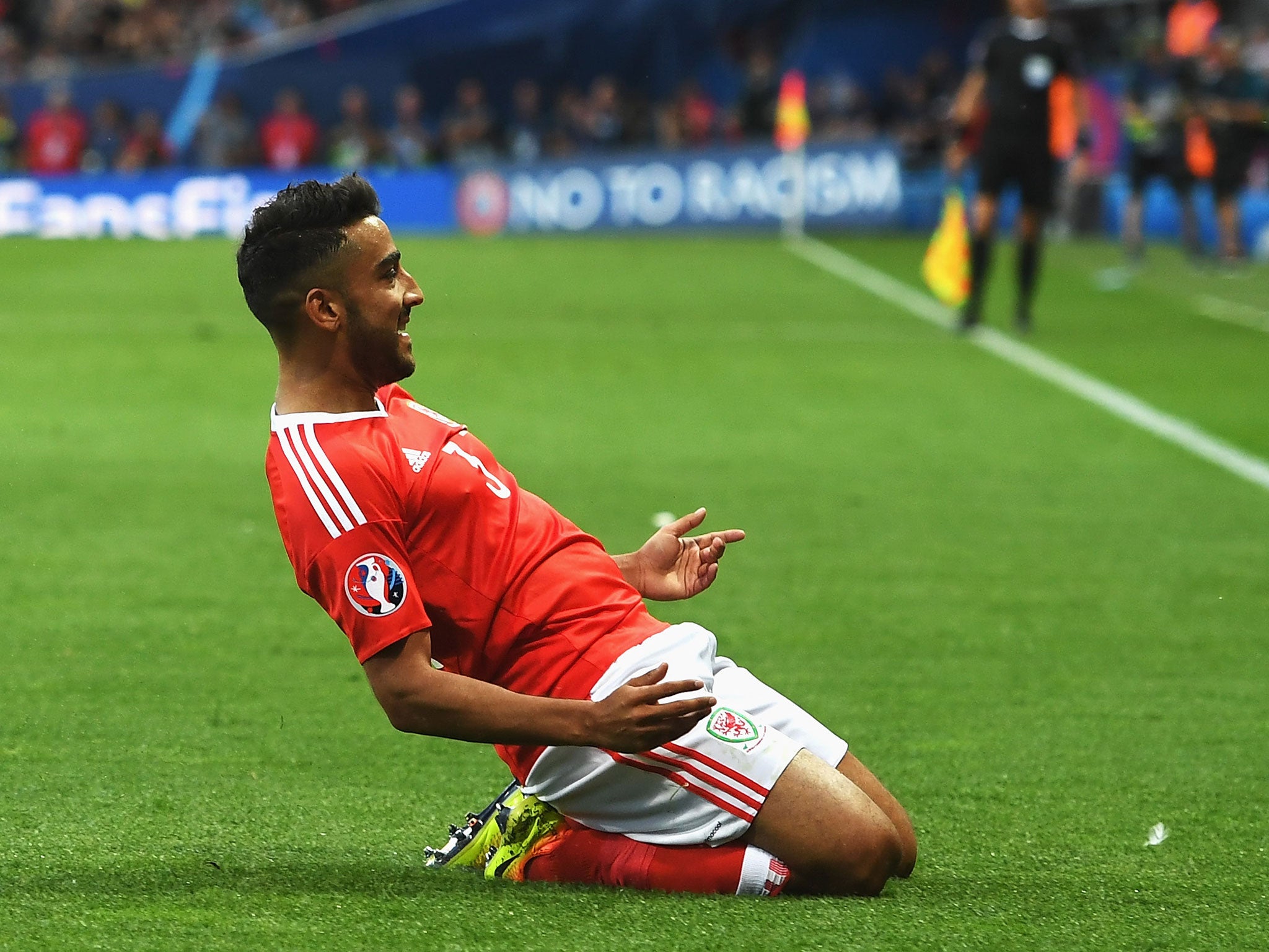 Neil Taylor celebrates after scoring Wales' second goal in Toulouse on Monday night