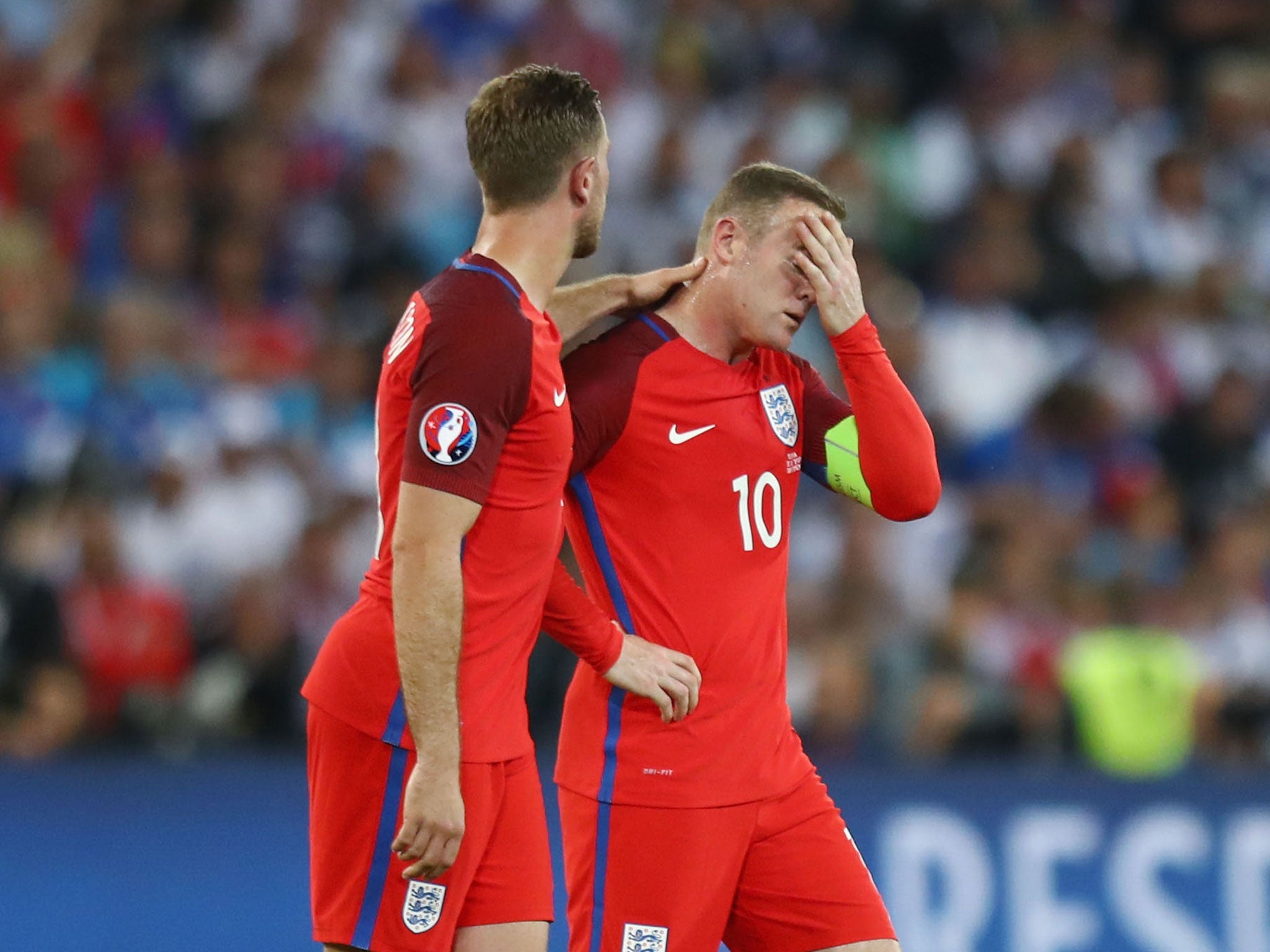 Jordan Henderson consoles Wayne Rooney during the Euros