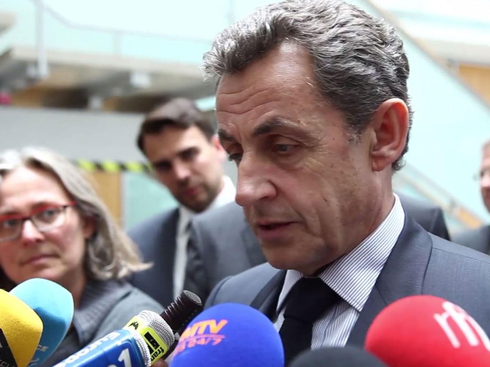 Former French President Nicolas Sarkozy spoke to reporters after meeting with German Chancellor Angela Merkel in Berlin, Germany