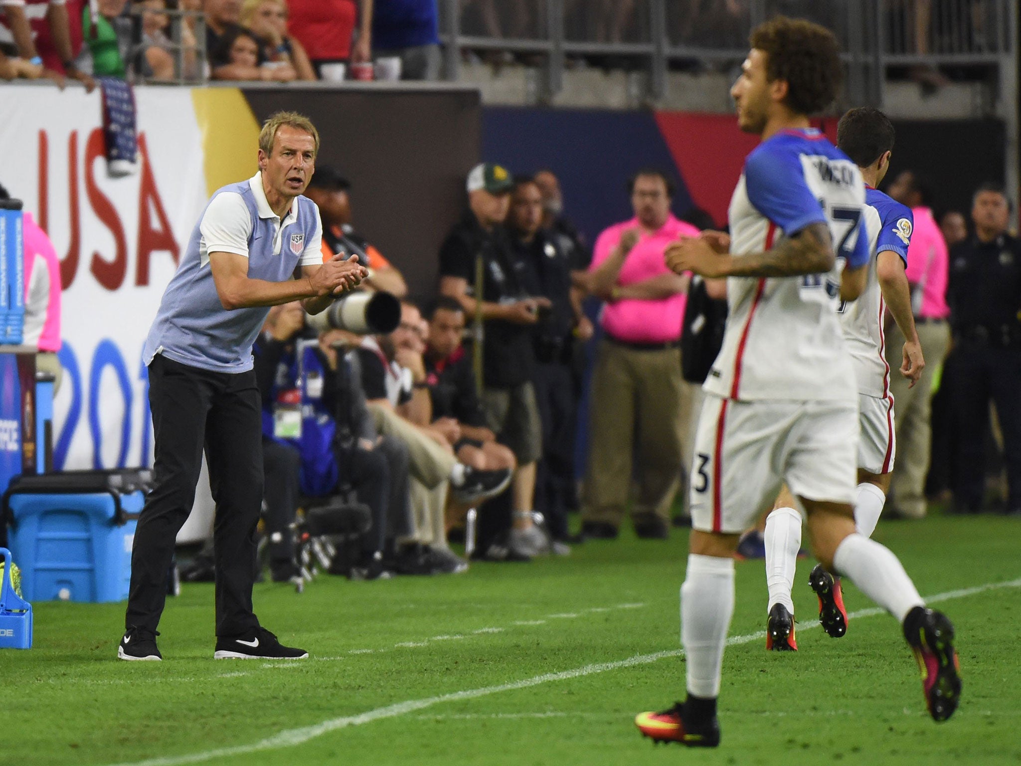 US coach Jurgen Klinsmann urges his team on against Argentina in the Copa America semi-final