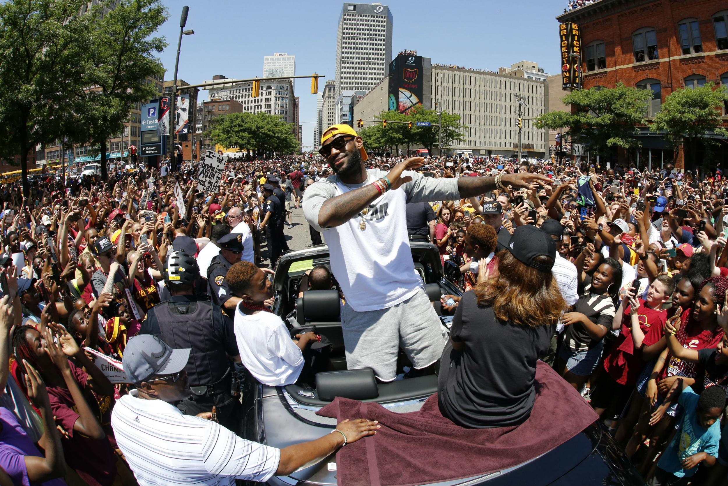 LeBron James leads the celebration as the Cleveland Cavaliers were honoured in the Ohio city