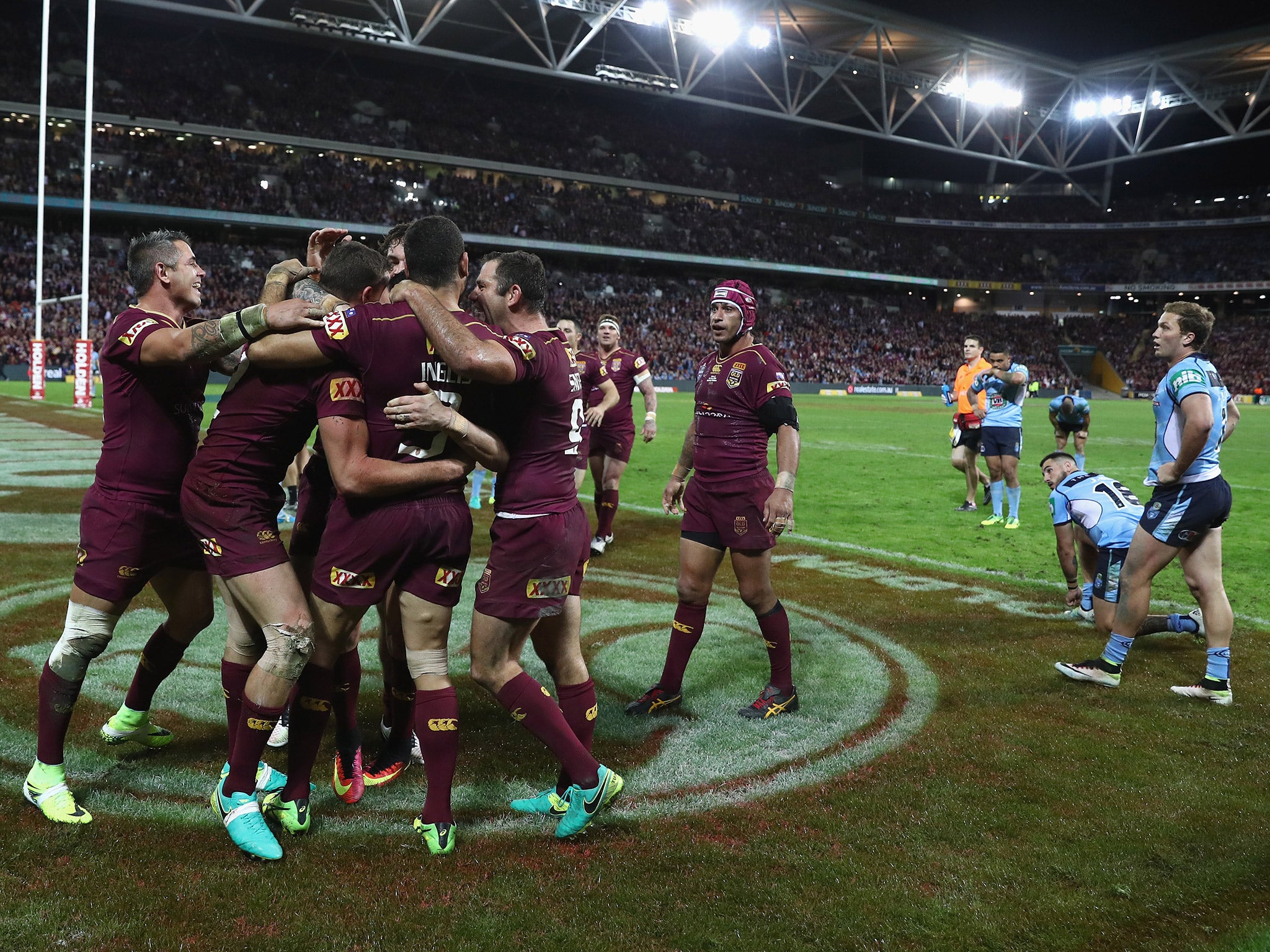 Queensland celebrate a try during the 26-16 win over New South Wales in State of Origin II