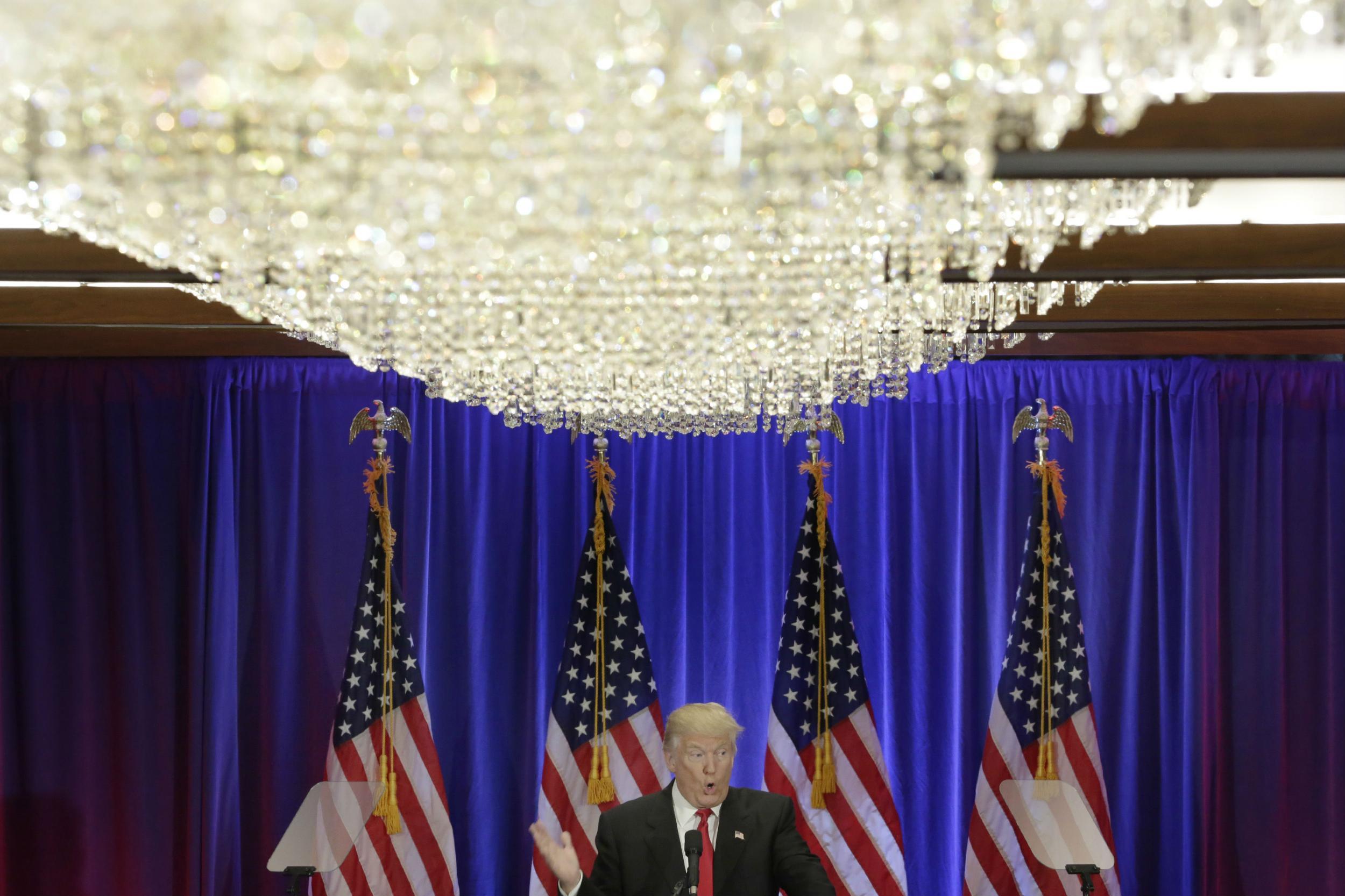 Trump reads his speech from a teleprompter in his Soho hotel