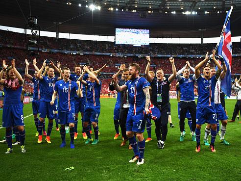 Iceland's players celebrate their qualification at the final whistle in Paris (Getty)