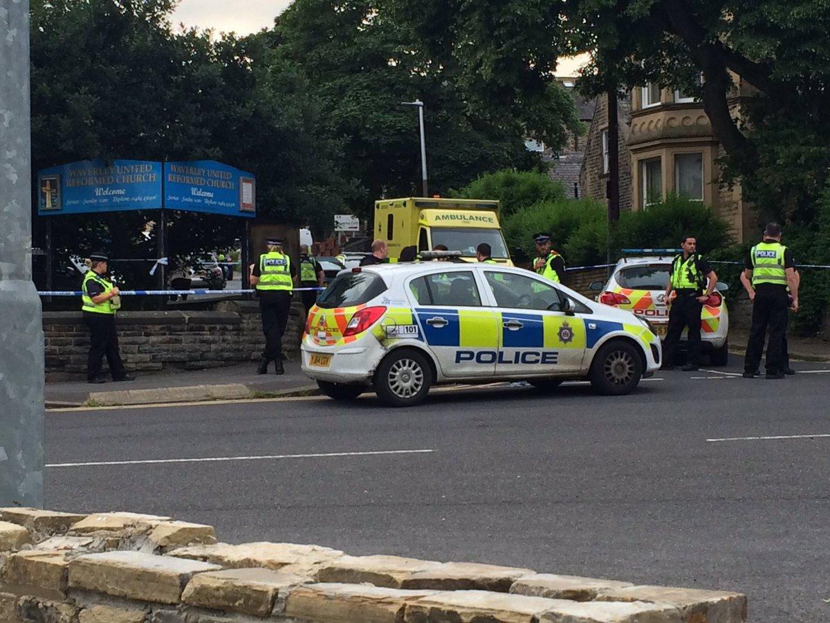 Police outside a polling station in north west Huddersfield where a man was stabbed