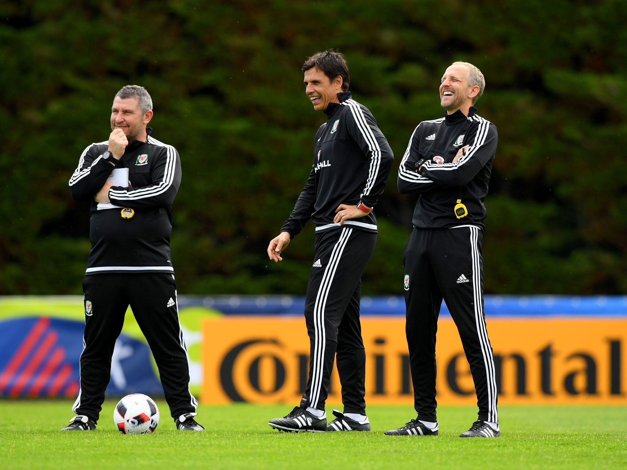 Chris Coleman shares a joke with his coaching staff during Euro 2016