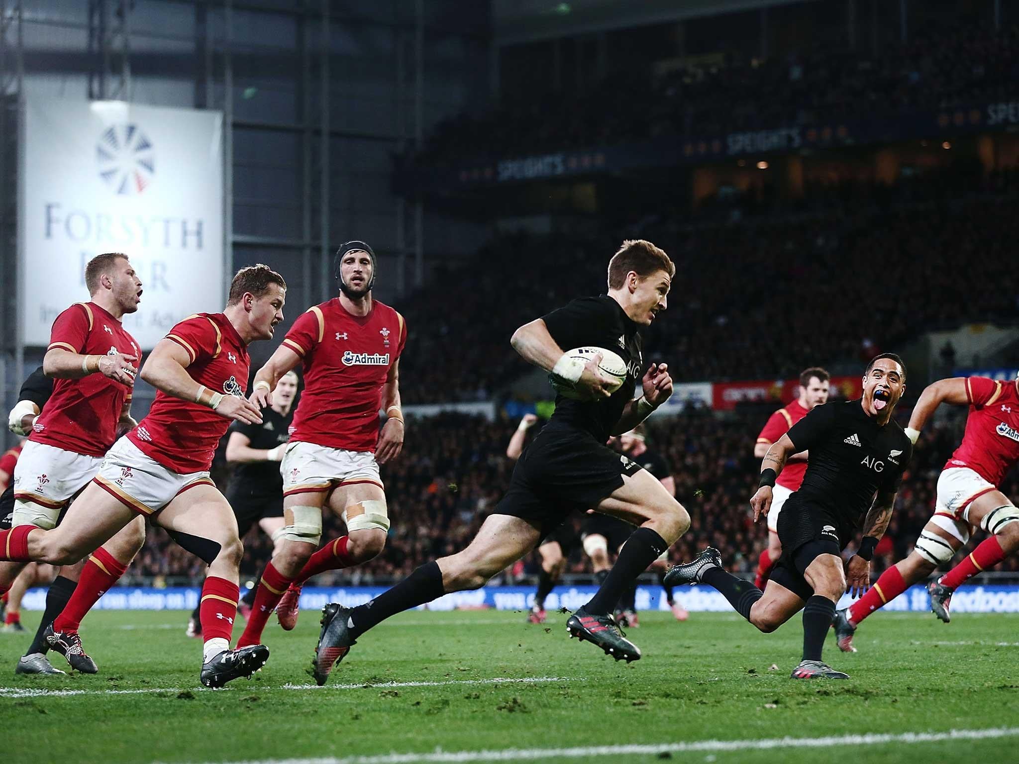 Beauden Barrett runs in a try for New Zealand to see off Wales