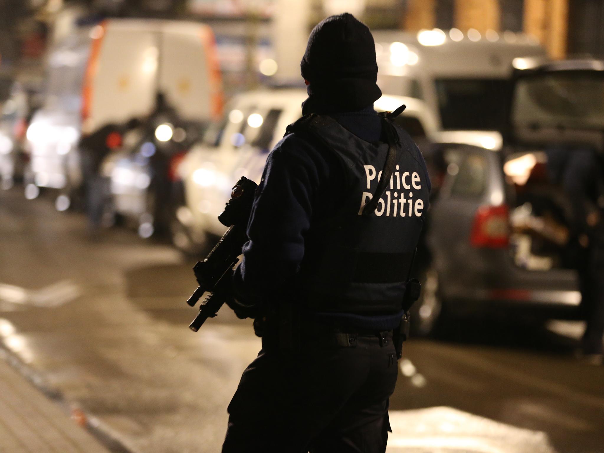 Police officers take part in an operation in Schaerbeek - Schaarbeek, Brussels, late on March 24, 2016