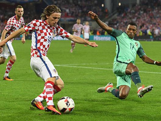 &#13;
Nani of Portugal challenges Croatian midfielder Luka Modric on Saturday evening (Getty)&#13;