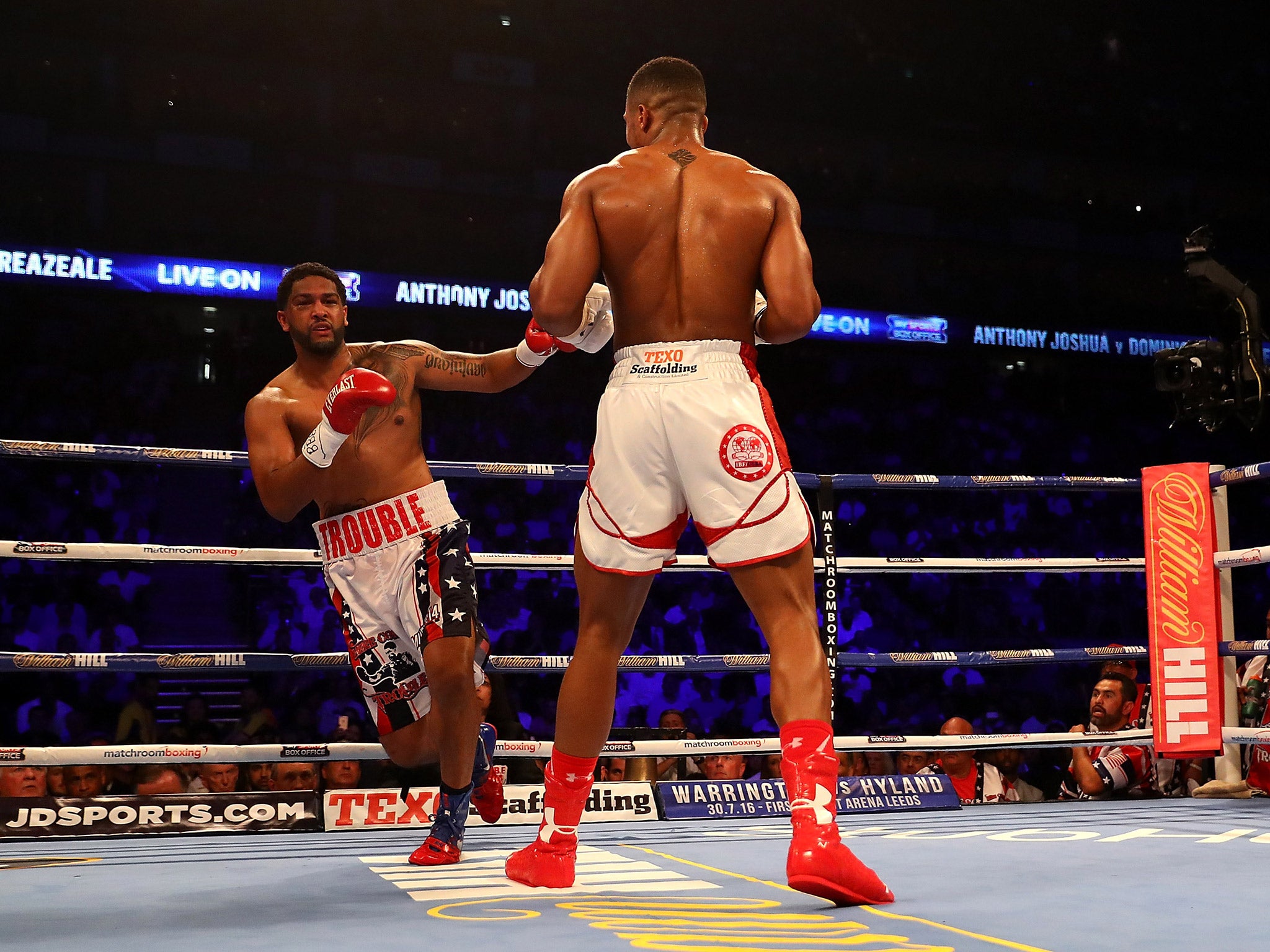 Dominic Breazeale stumbles after a big right hand from Anthony Joshua