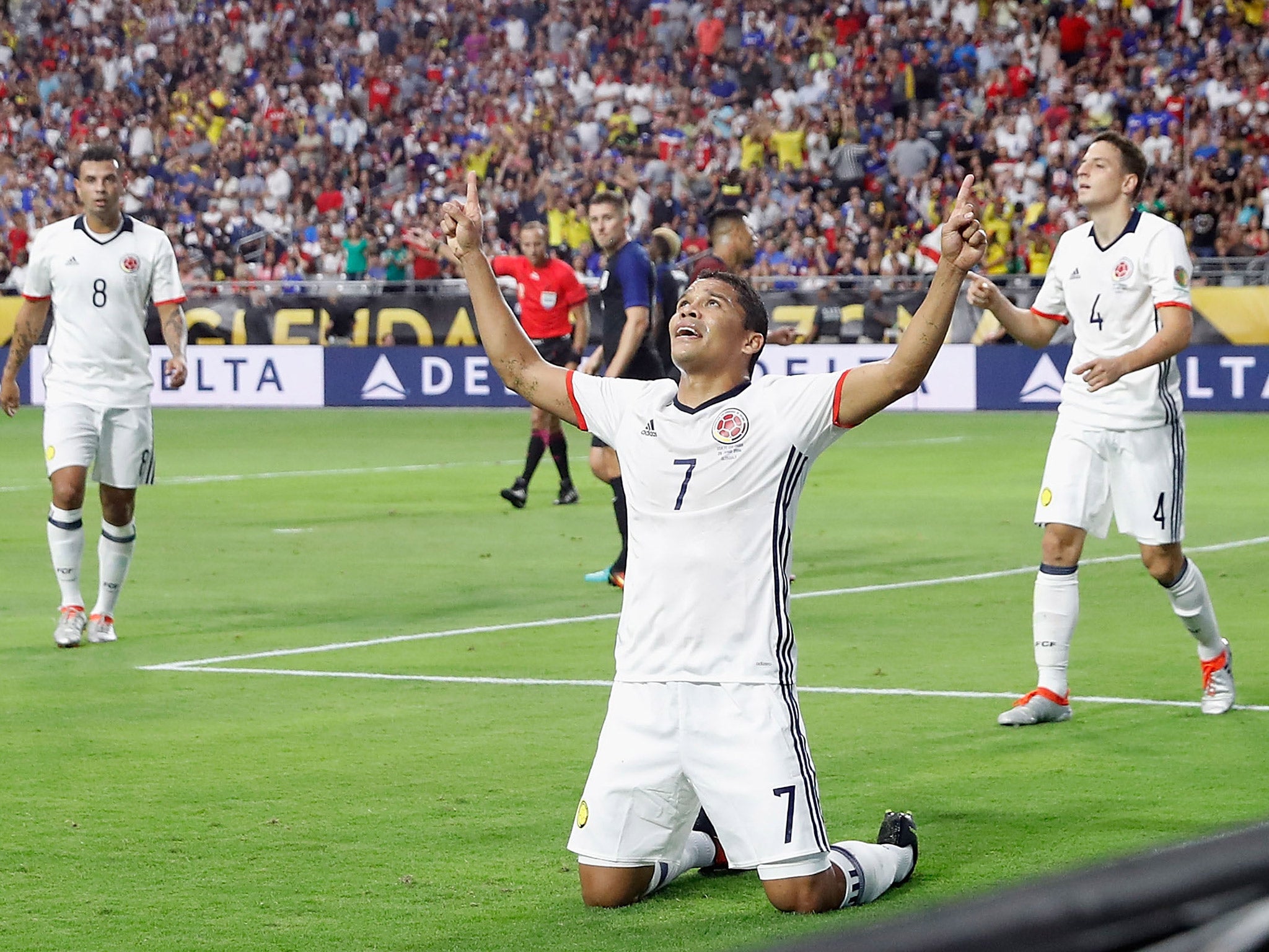 Carlos Bacca celebrates scoring the winning goal for Colombia