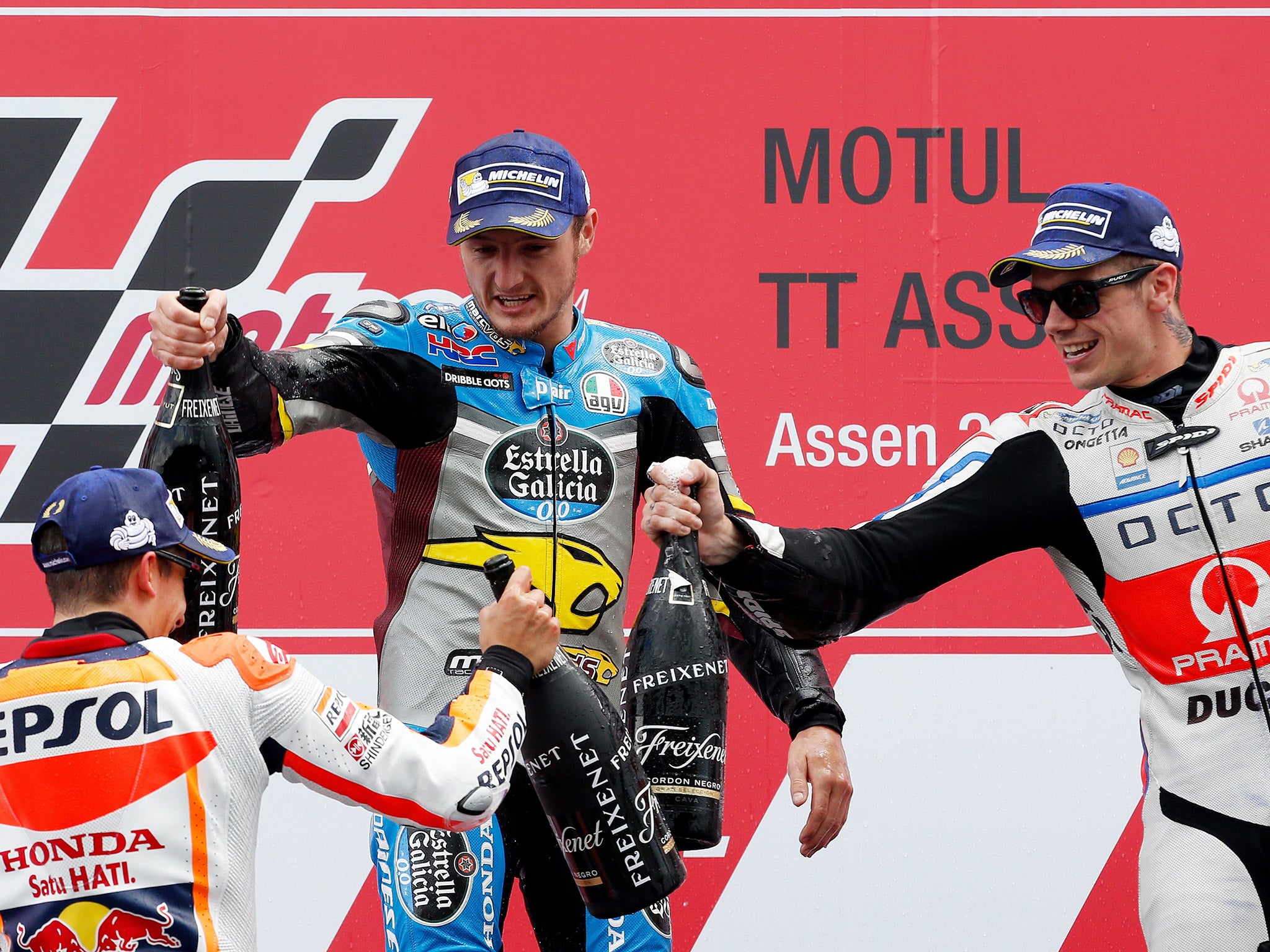 Miller (C) celebrates with Marquez (L) and Scott Redding (R) on the podium