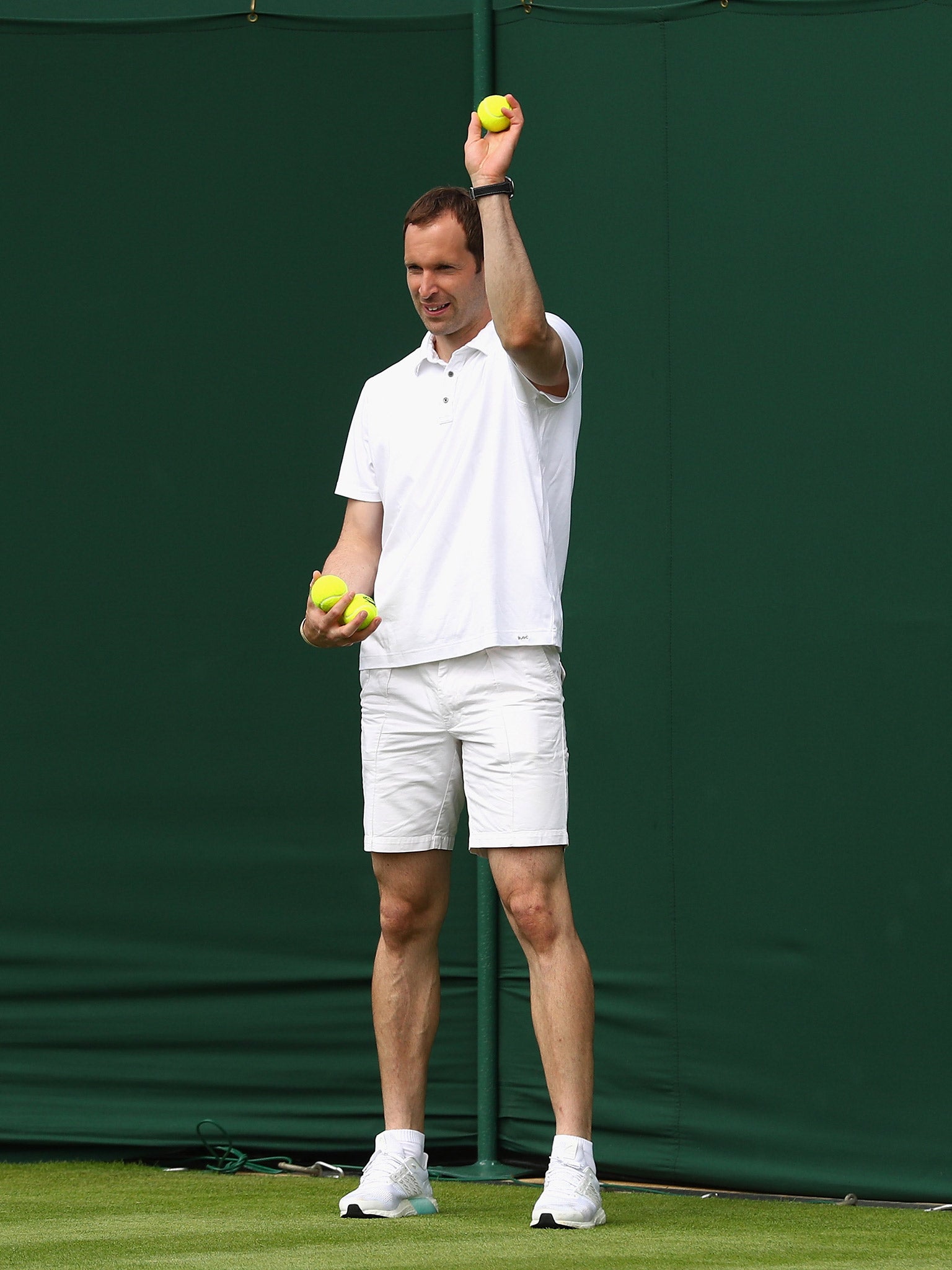 Cech acts as a ball boy during a training session at Wimbledon