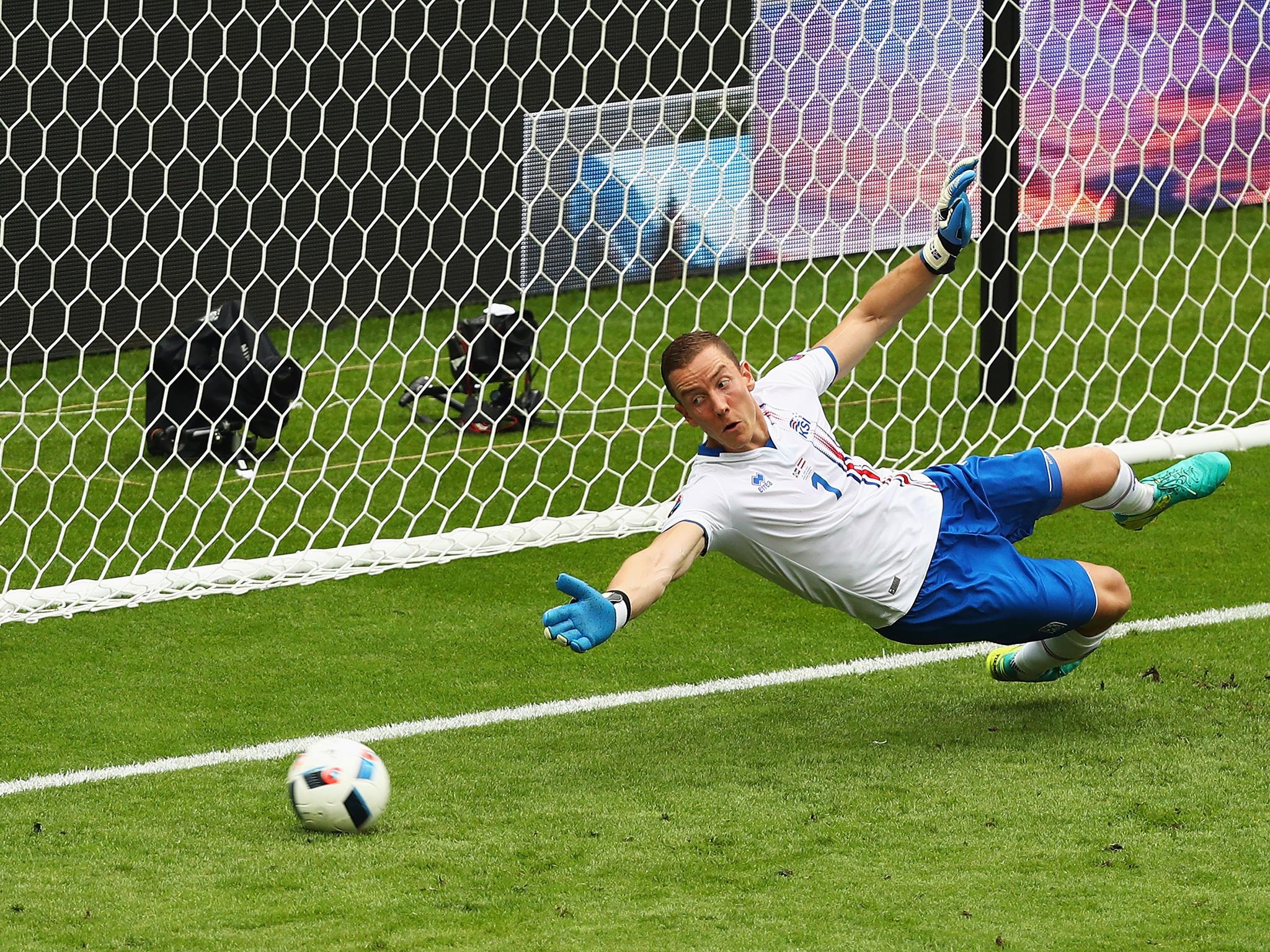 Halldorsson watches Dragovic's penalty fly past the post