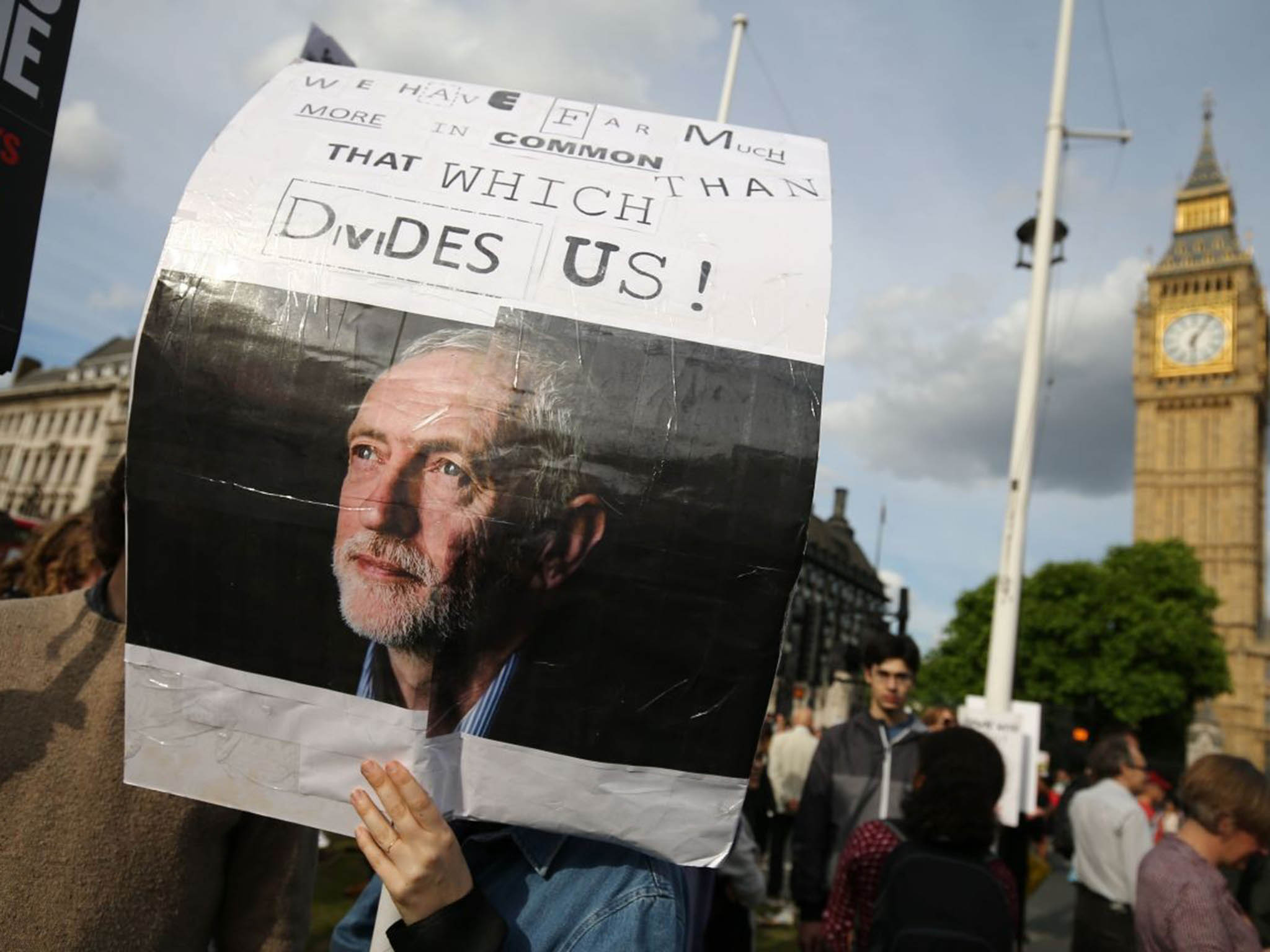 A protester holds up a placard in support of Leader of the opposition Labour Party Jeremy Corbyn outside parliament during a pro-Corbyn demonstration in central London on June 27, 2016 (AFP/ Getty)