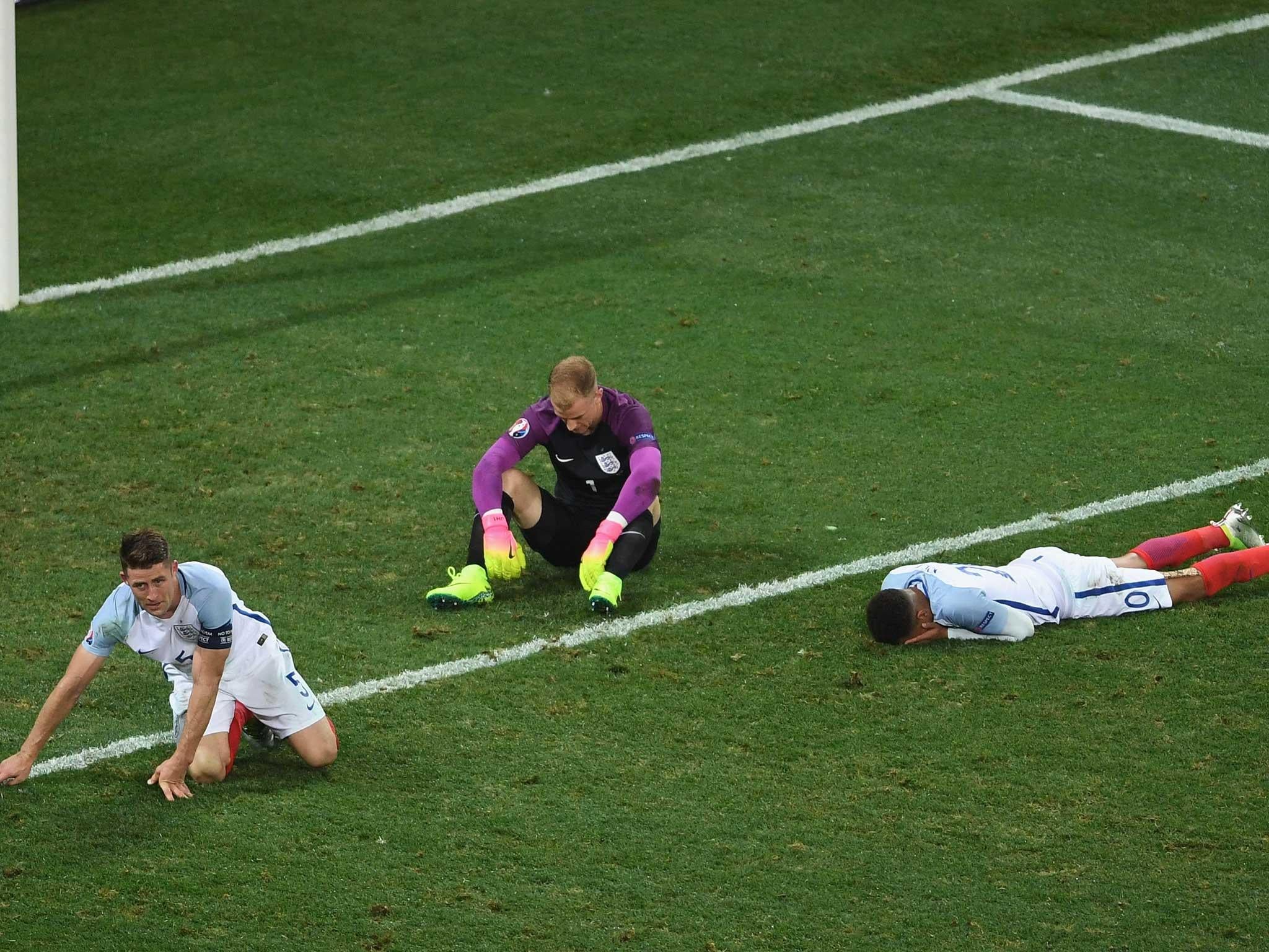 England's players slump to the turf at full-time